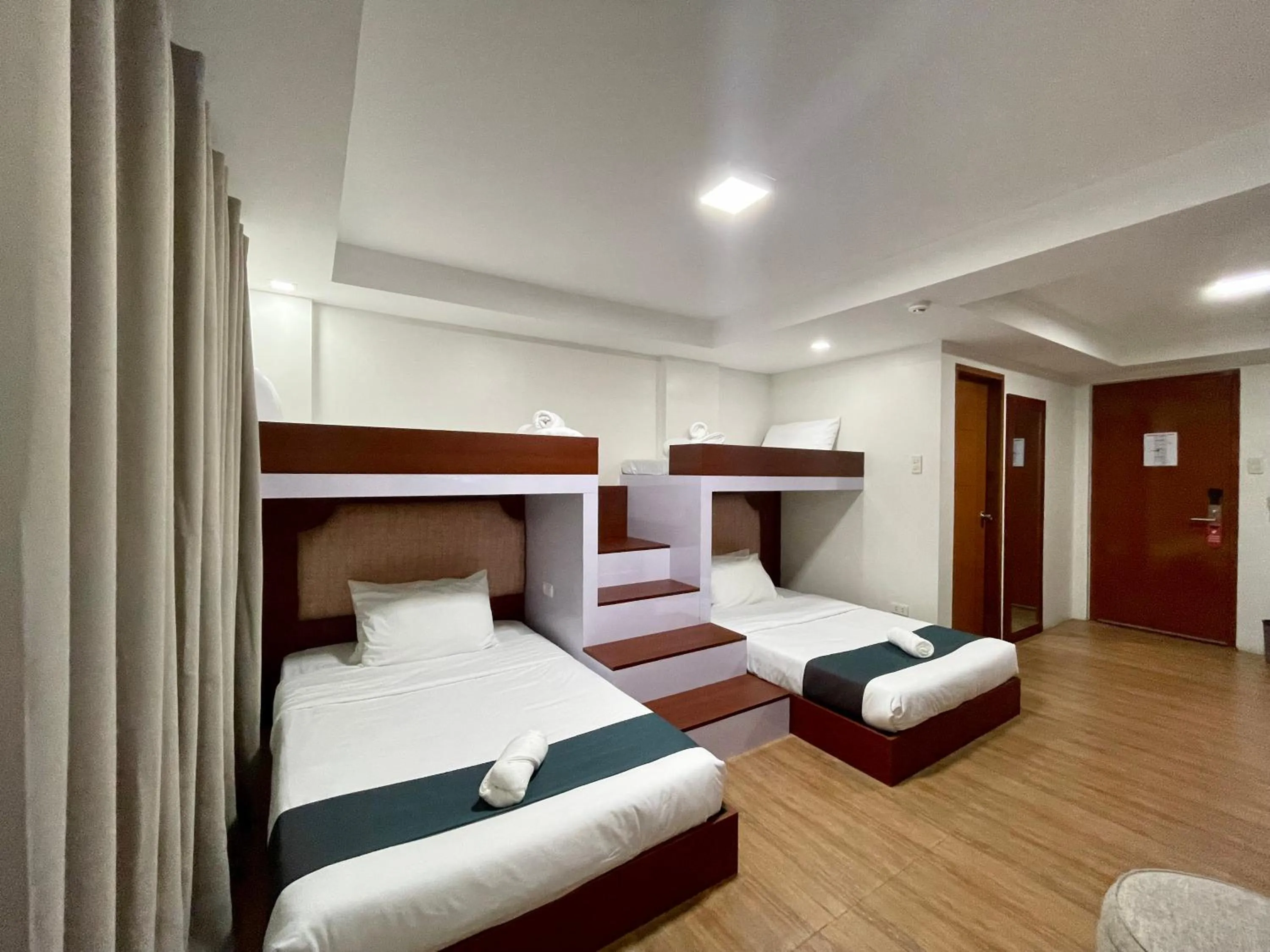 Bed in Staycation Hotel