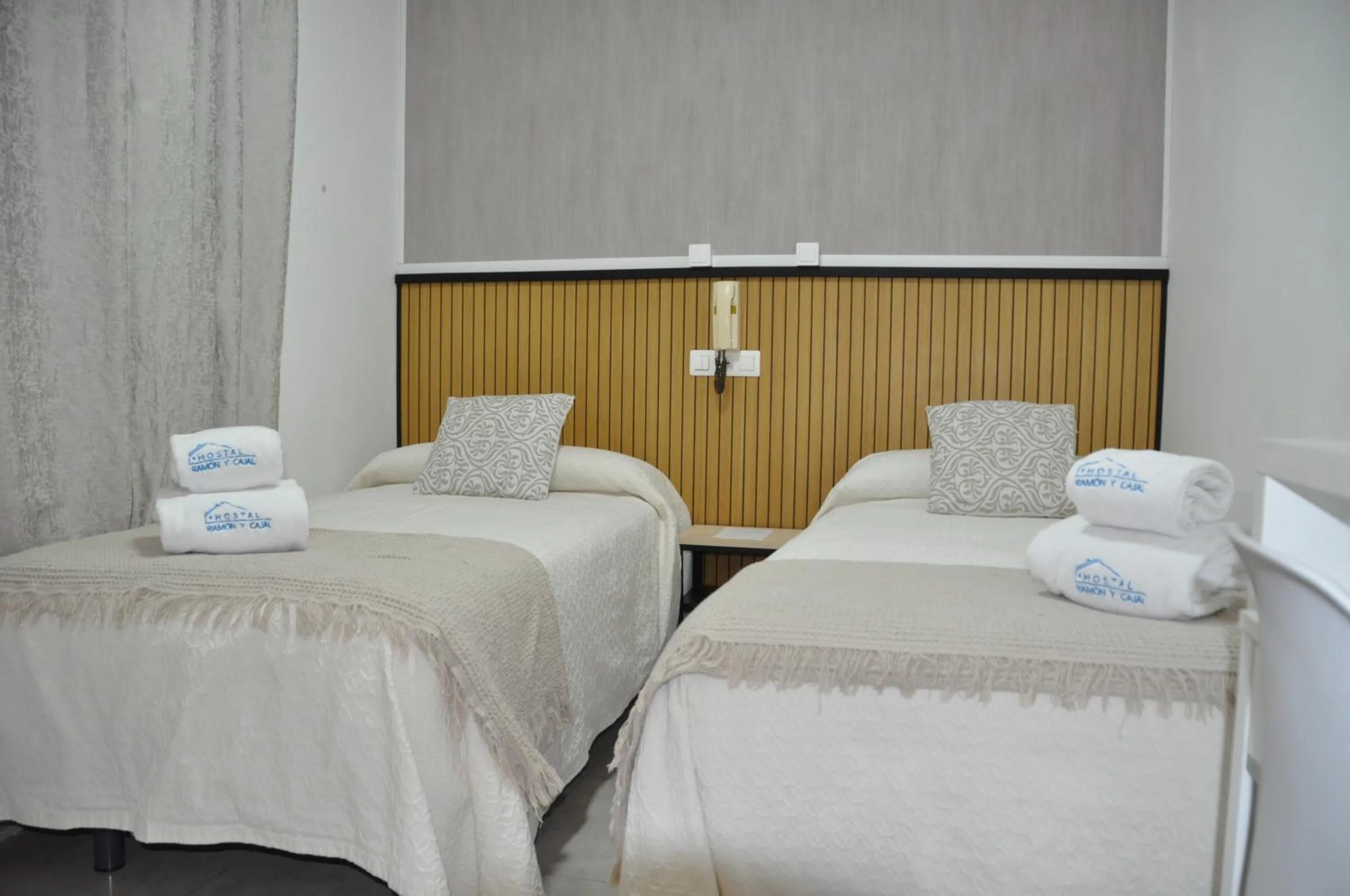 Bed in Hostal Ramón y Cajal