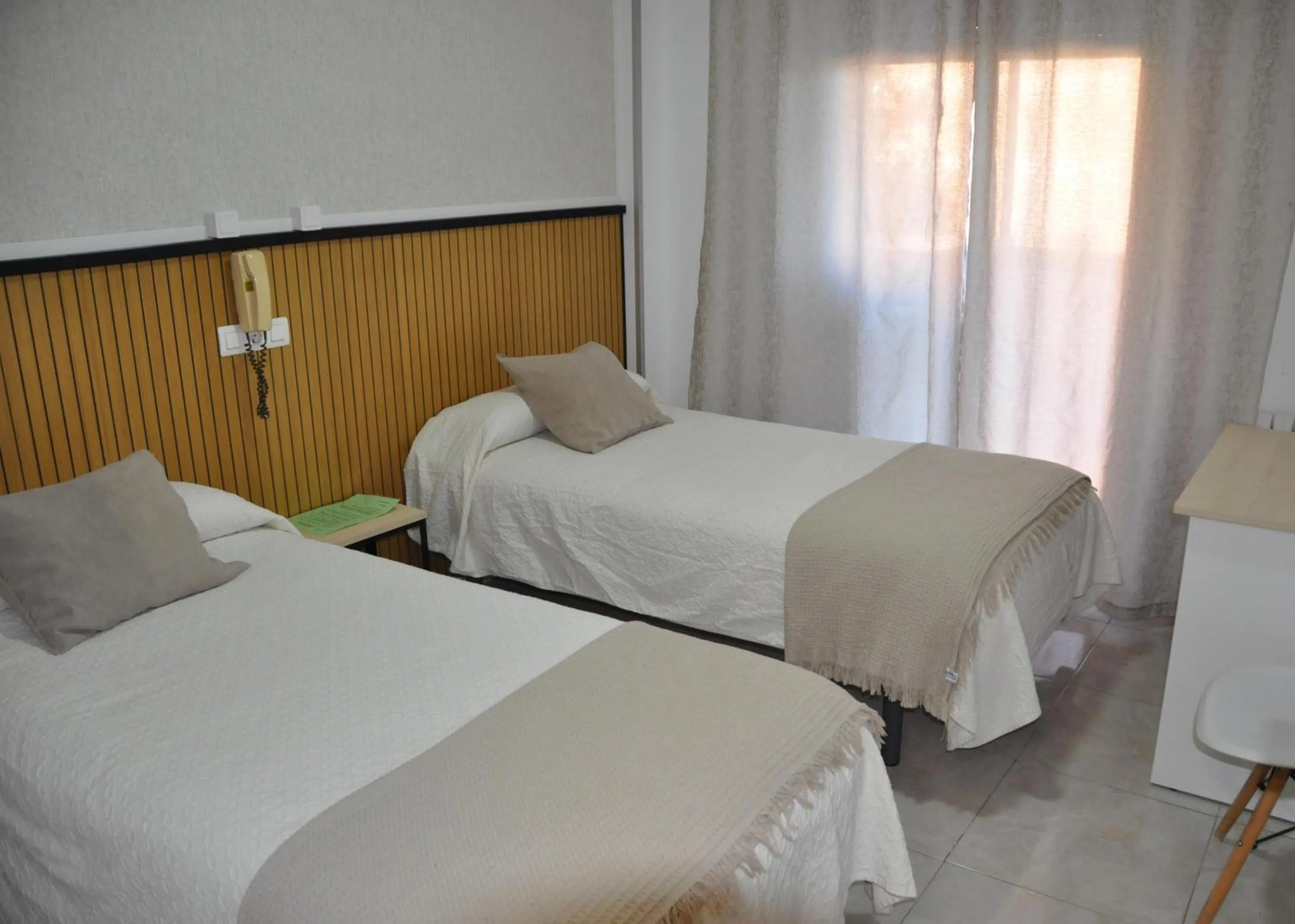 Bed in Hostal Ramón y Cajal