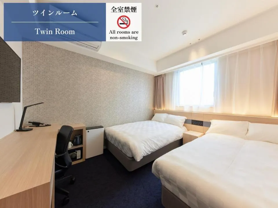Bed in Henn na Hotel Premier Kagoshima Tenmonkan