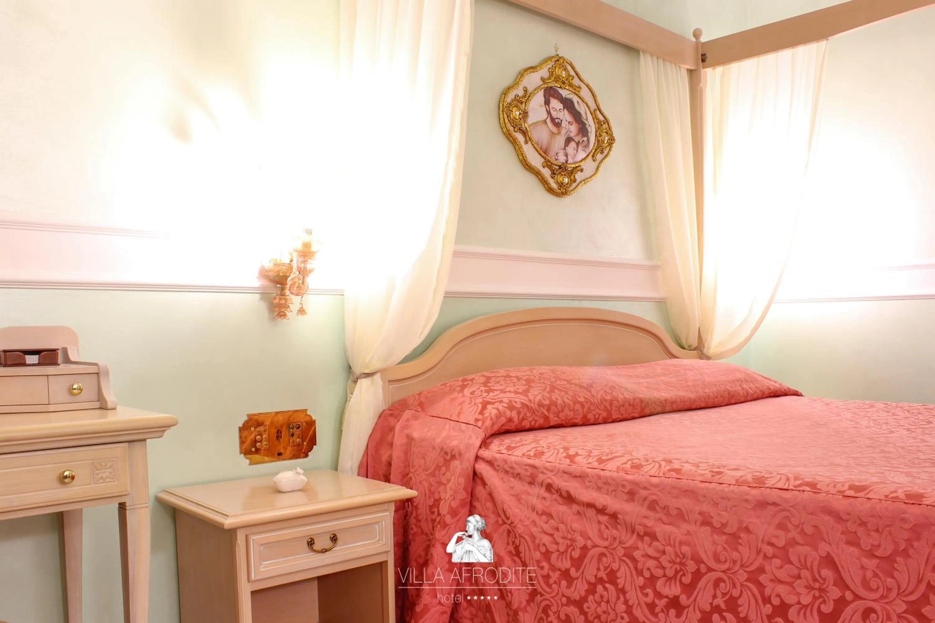 Bed in Afrodite Boutique Hotel