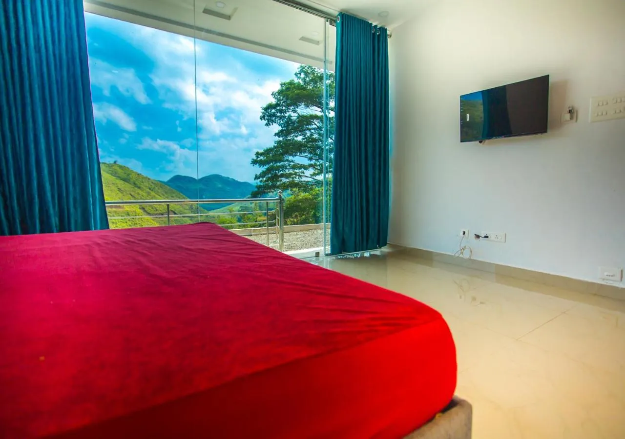 Communal lounge/ TV room, Bed in Hidden Valley Hill View Cottage Vagamon by VOYE HOMES - Rooms with Hill View