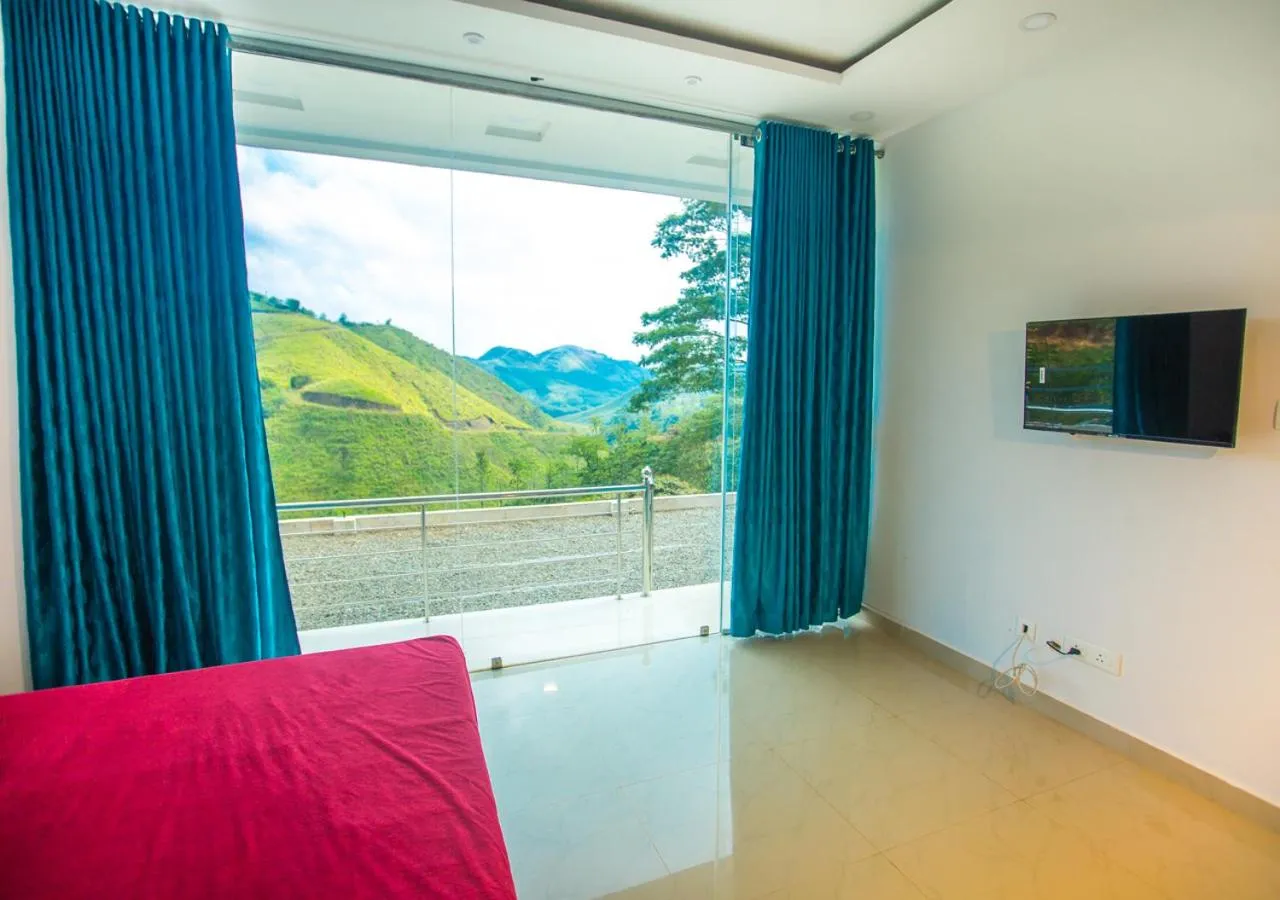 TV and multimedia in Hidden Valley Hill View Cottage Vagamon by VOYE HOMES - Rooms with Hill View