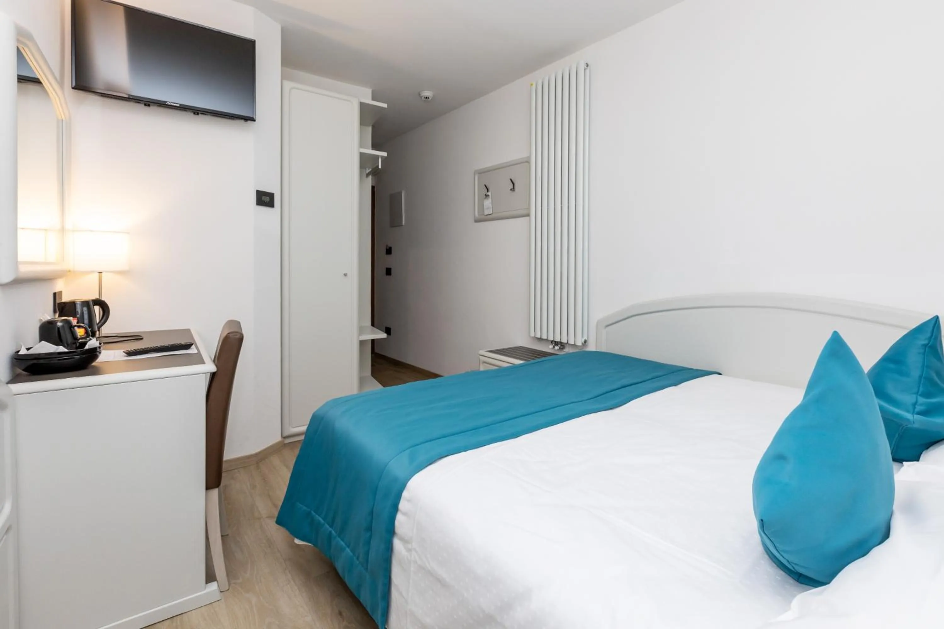 Bed in Albergo Cappello e Cadore