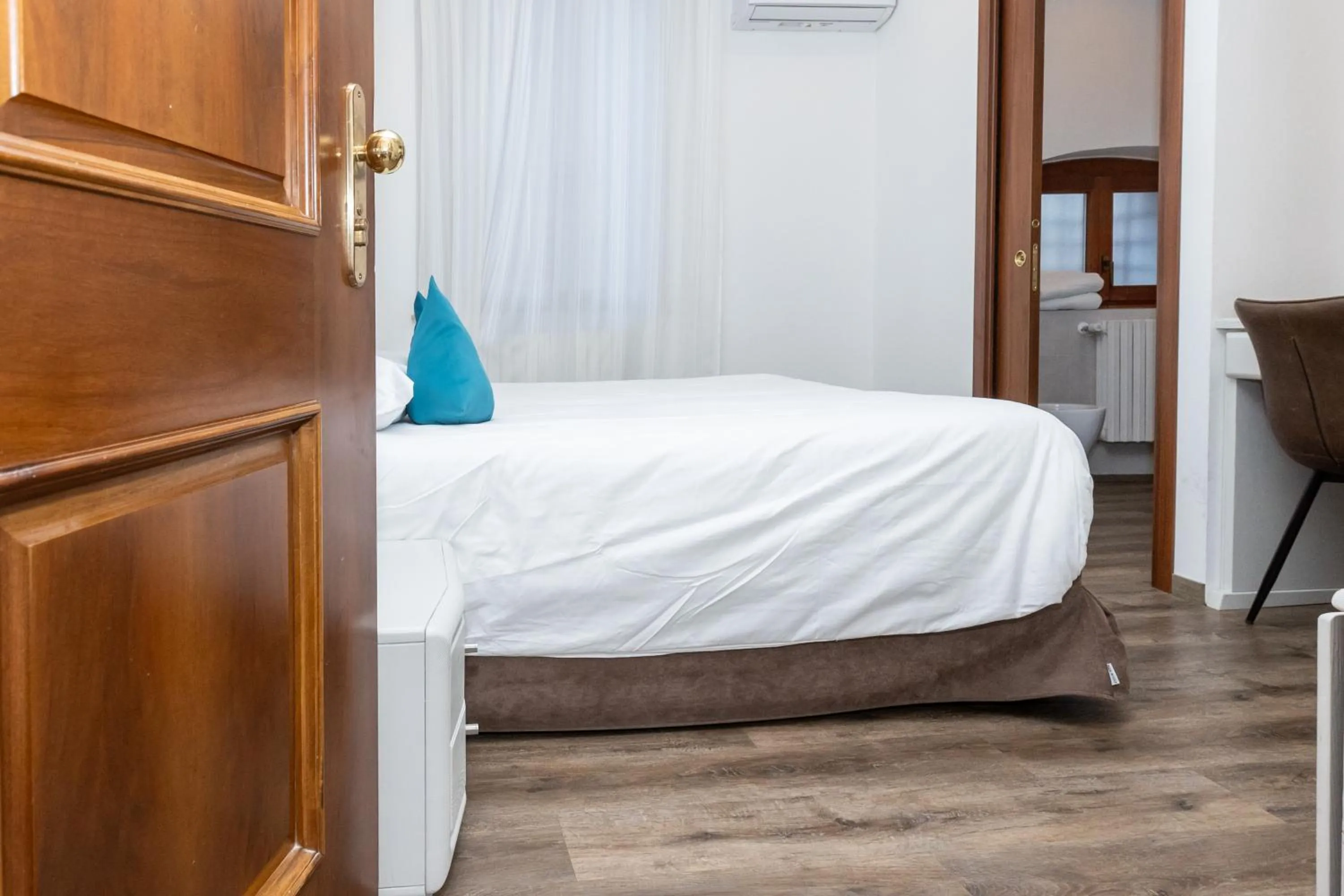 Bed in Albergo Cappello e Cadore