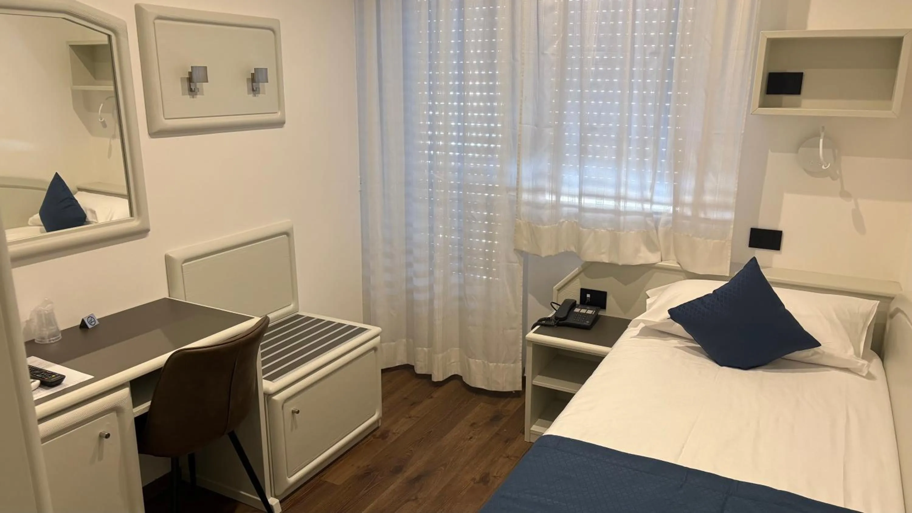 Bed in Albergo Cappello e Cadore