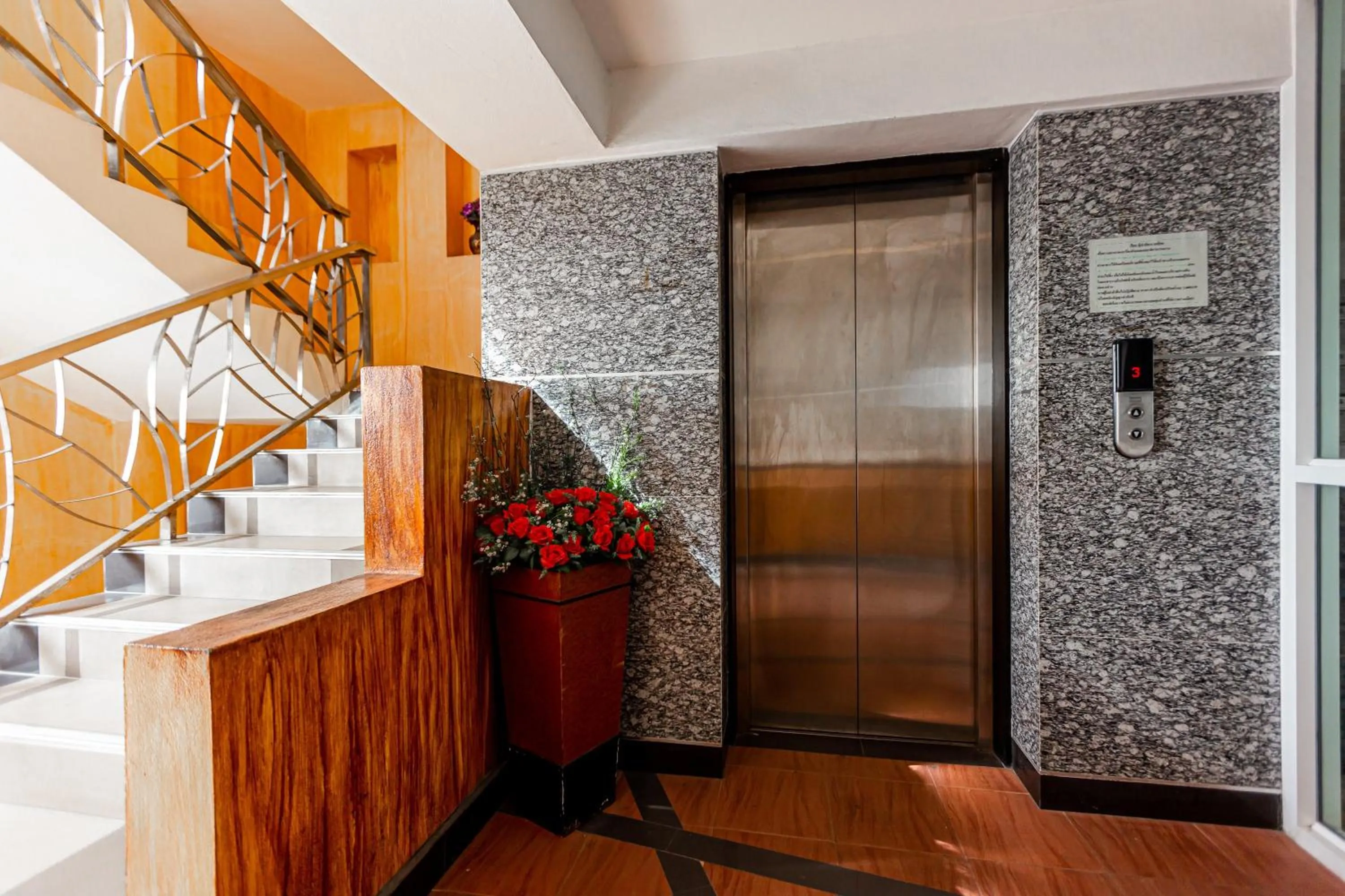 elevator in Latin Garden Hotel