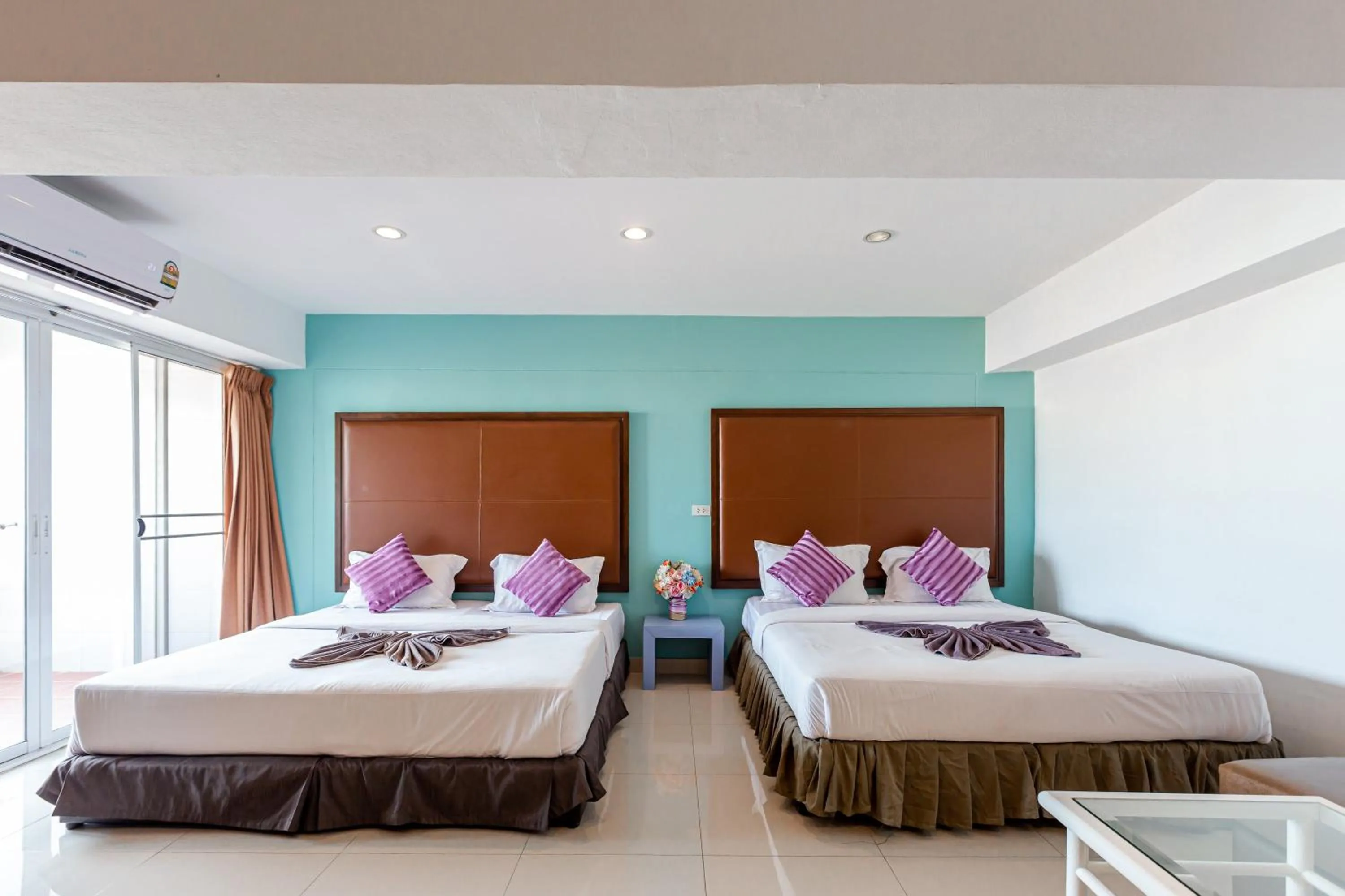 Bed in Latin Garden Hotel