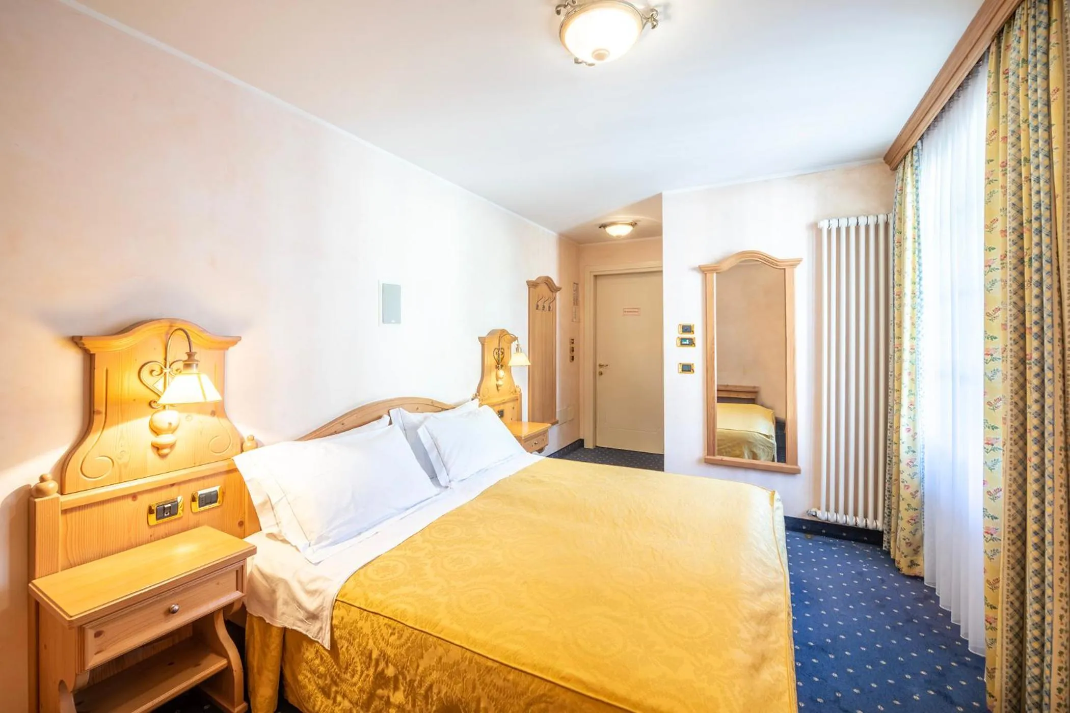 Bed in Hotel Relais Orsingher