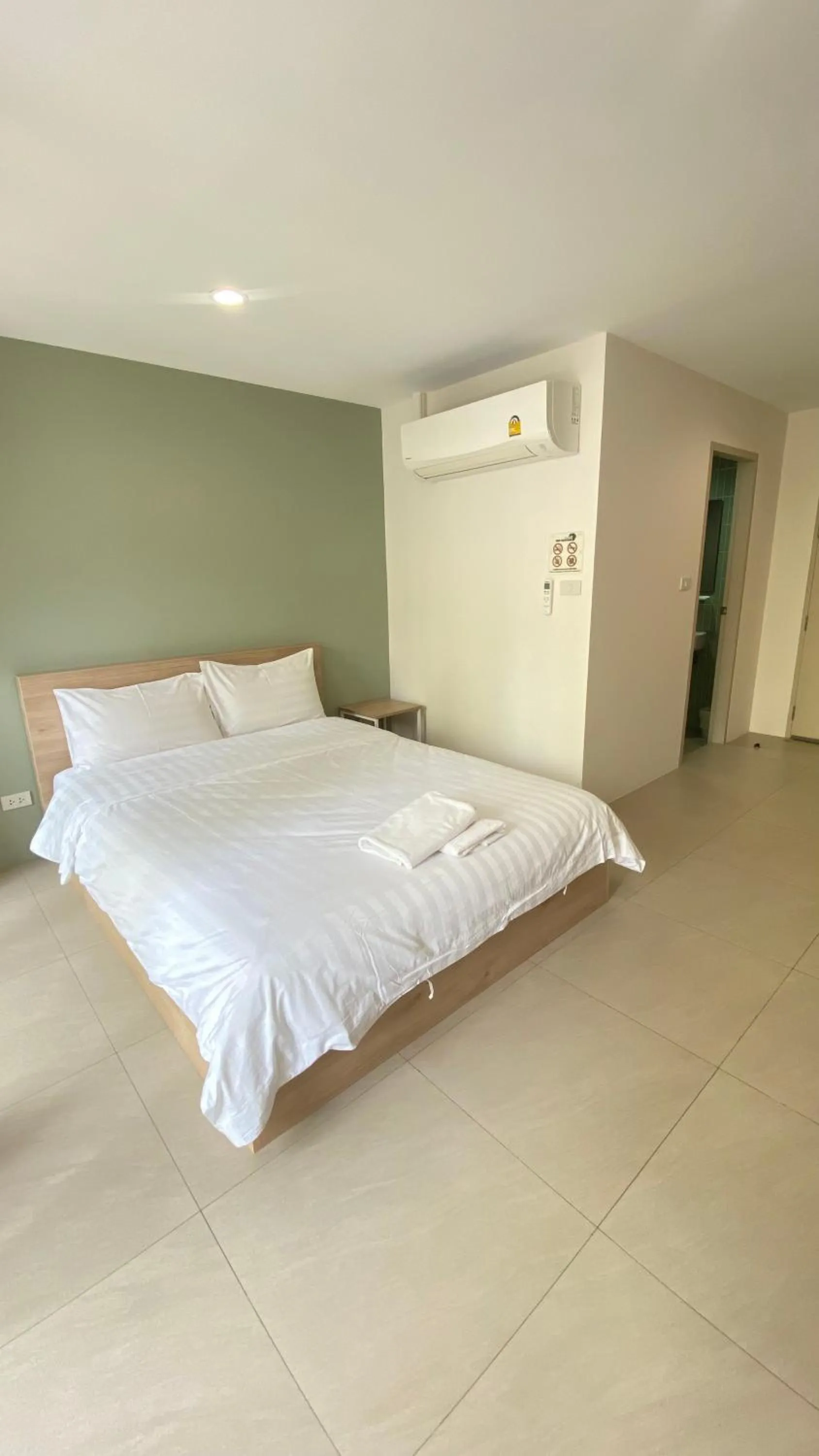 Bed in POP Heritage Residence