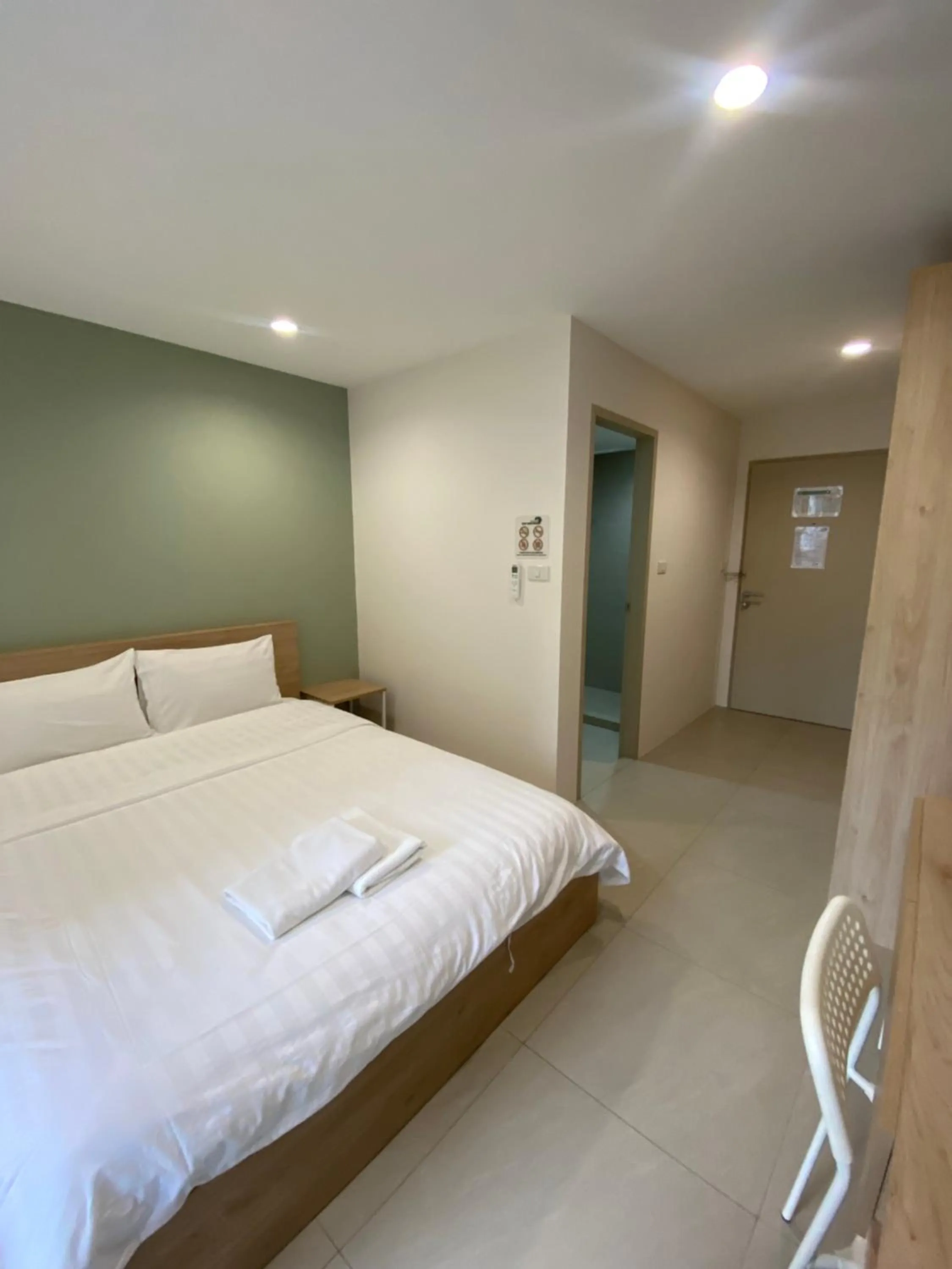 Bed in POP Heritage Residence