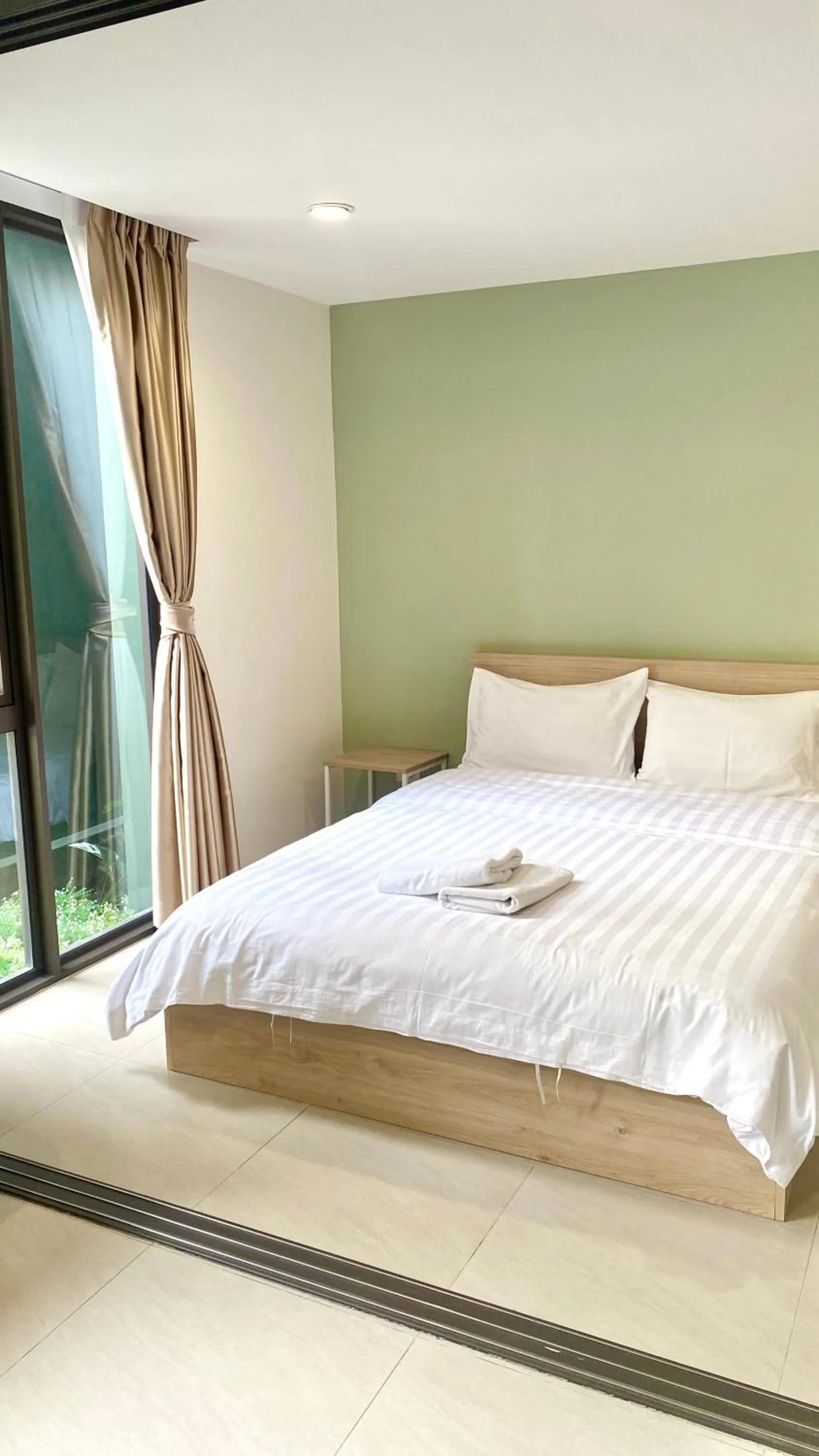 Bed in POP Heritage Residence