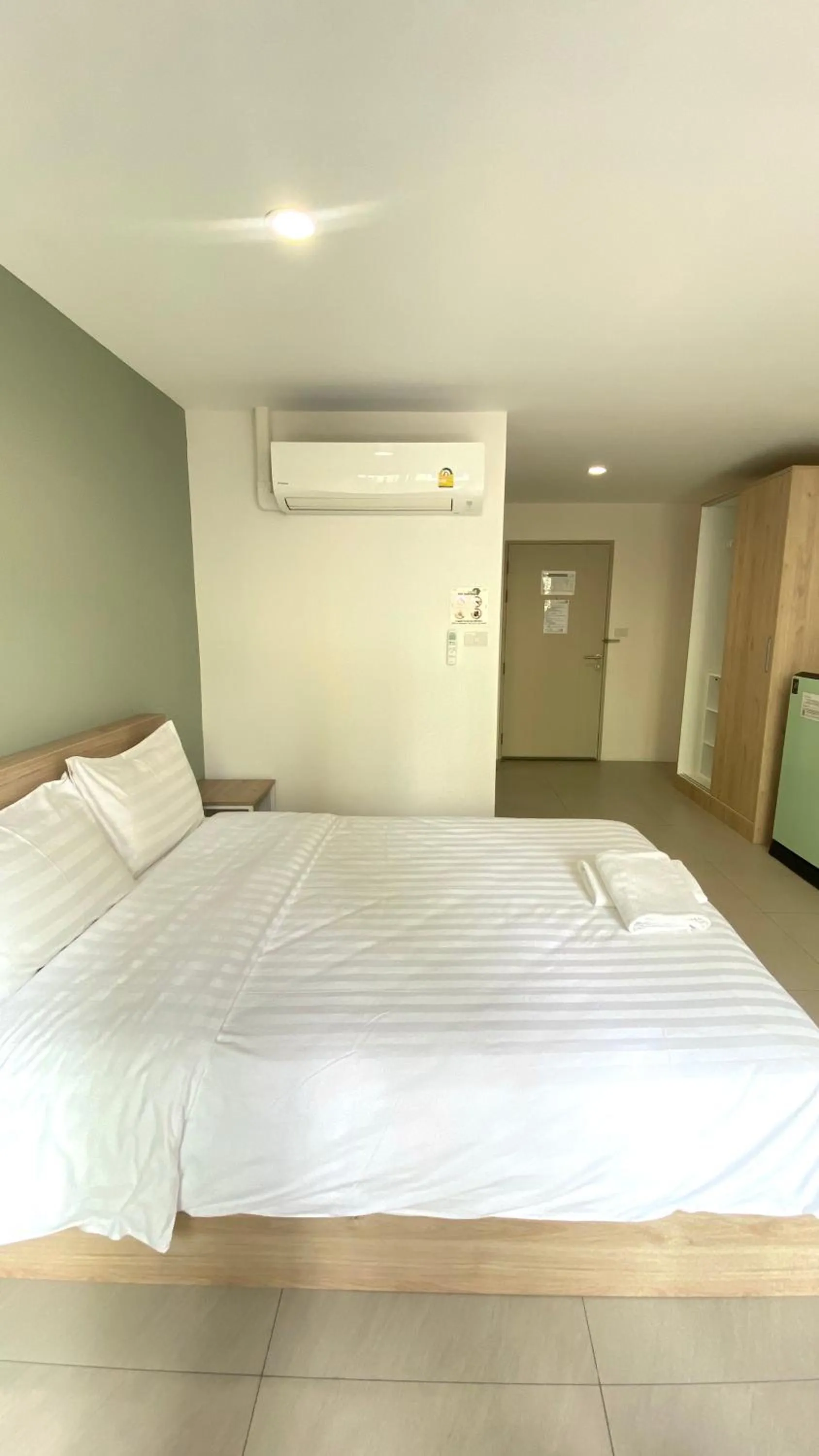 Bed in POP Heritage Residence