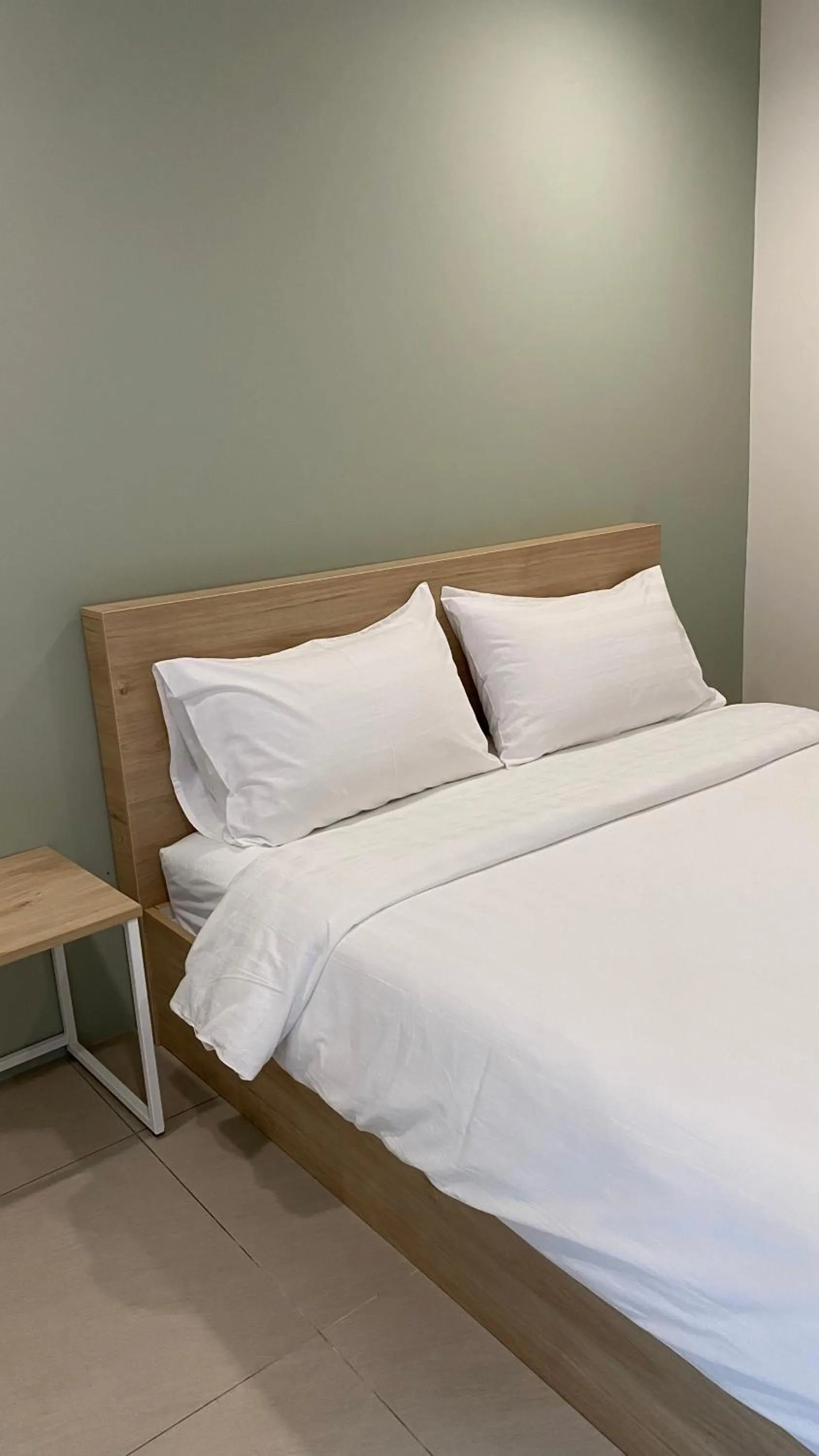 Bed in POP Heritage Residence