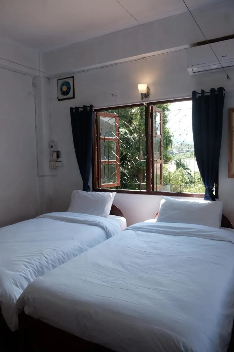 Bed in Sabaydee Guesthouse