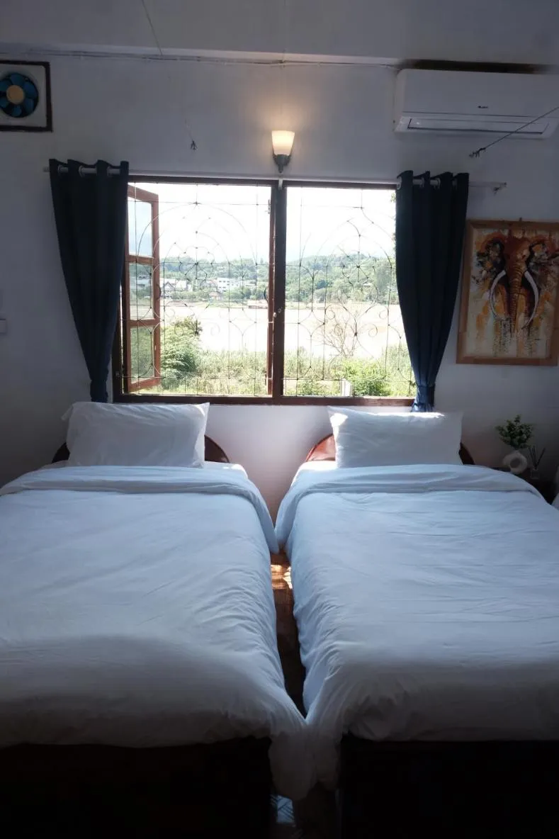 Bed in Sabaydee Guesthouse