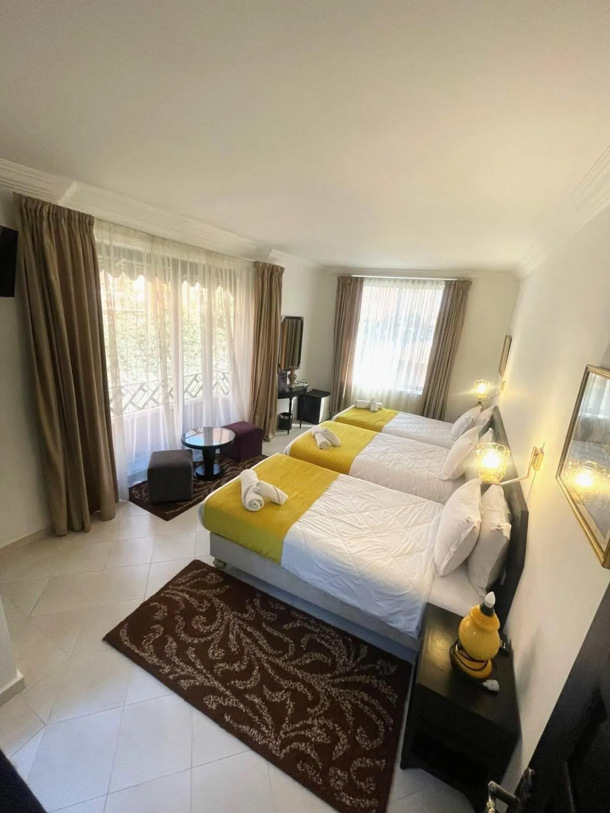 Bed in Majorel Perle Hôtel Riad Restaurant Picine & Spa