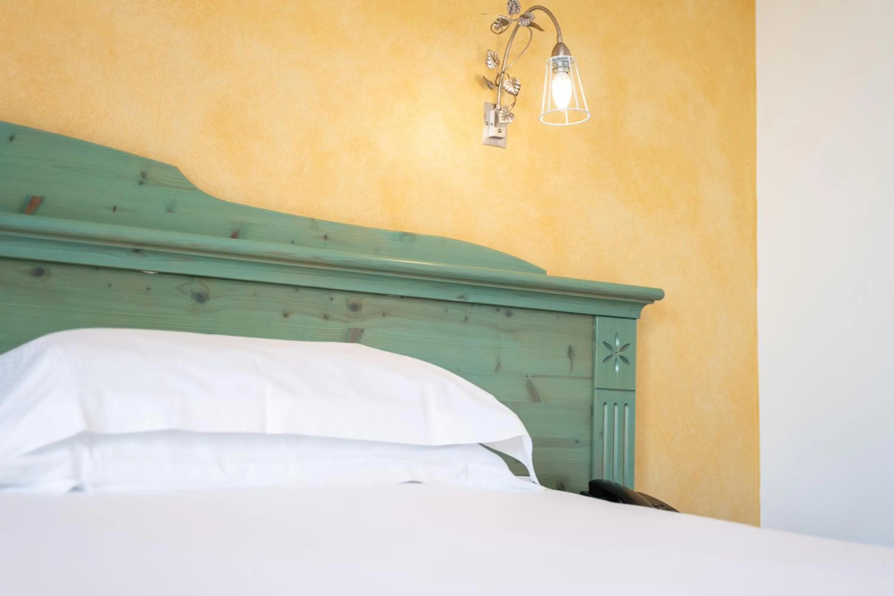 Bed in Hotel Residence Montelago