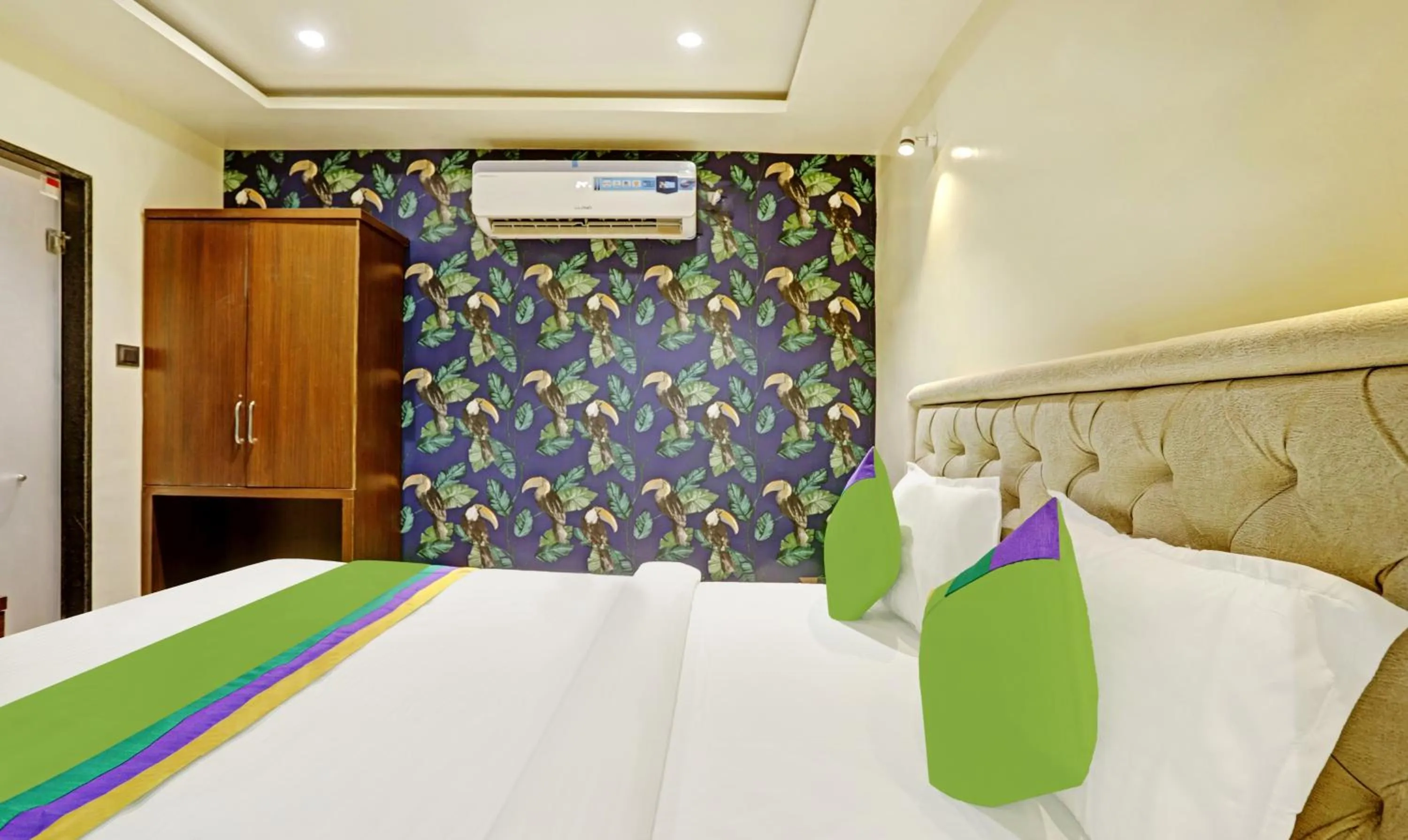 Bedroom, Bed in Treebo Risha