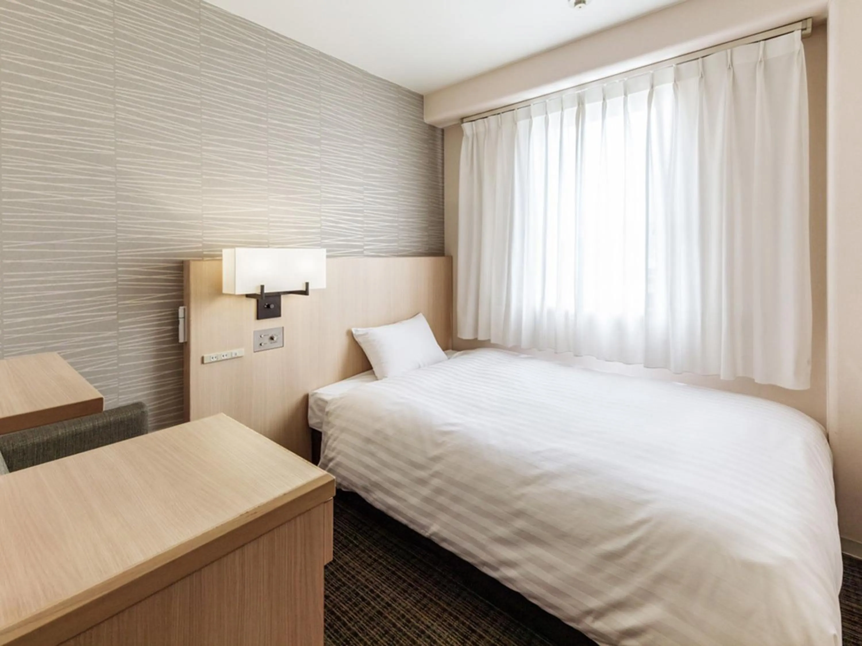 Photo of the whole room, Bed in Nishitetsu Resort Inn Beppu