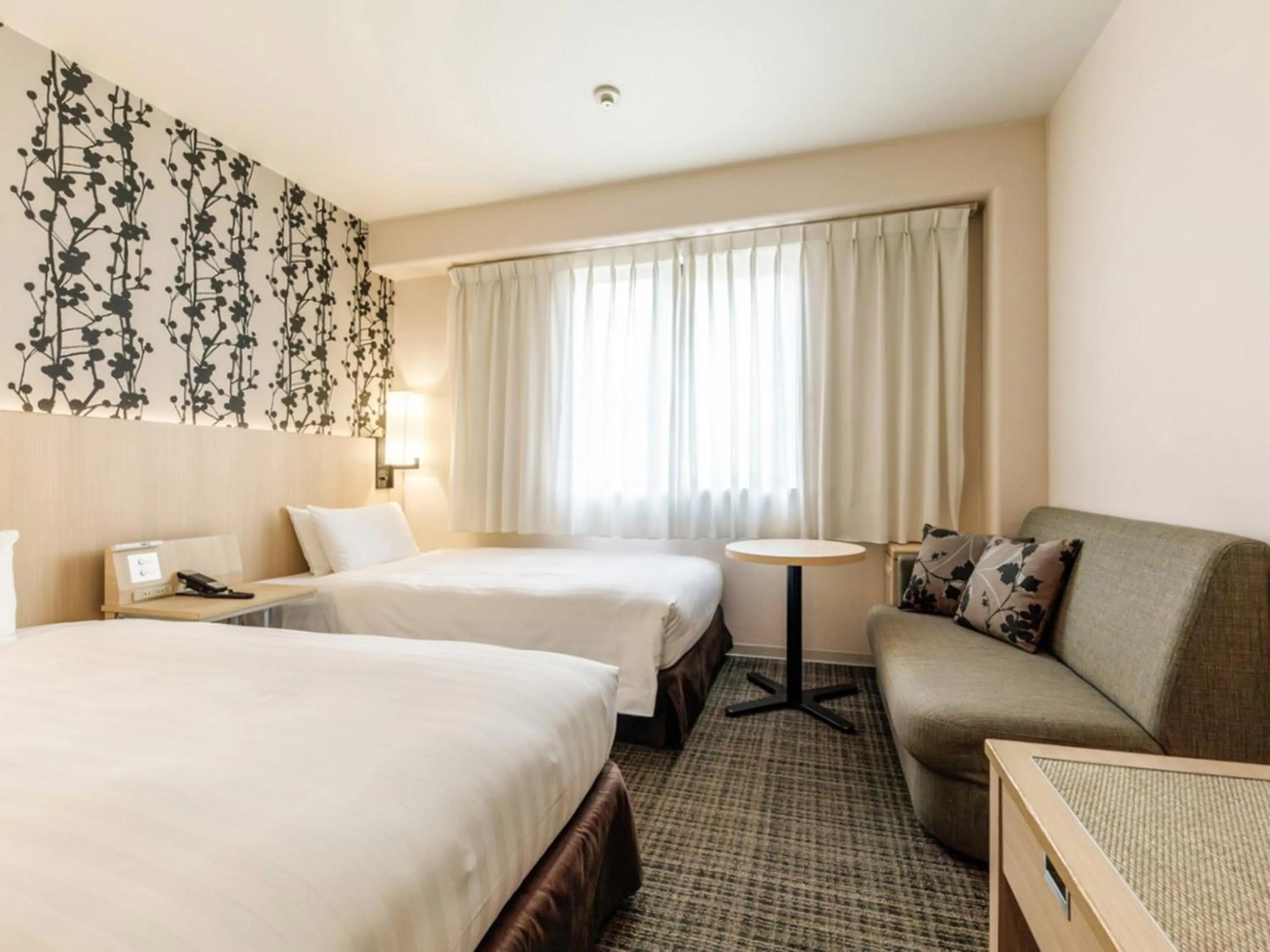 Photo of the whole room, Bed in Nishitetsu Resort Inn Beppu