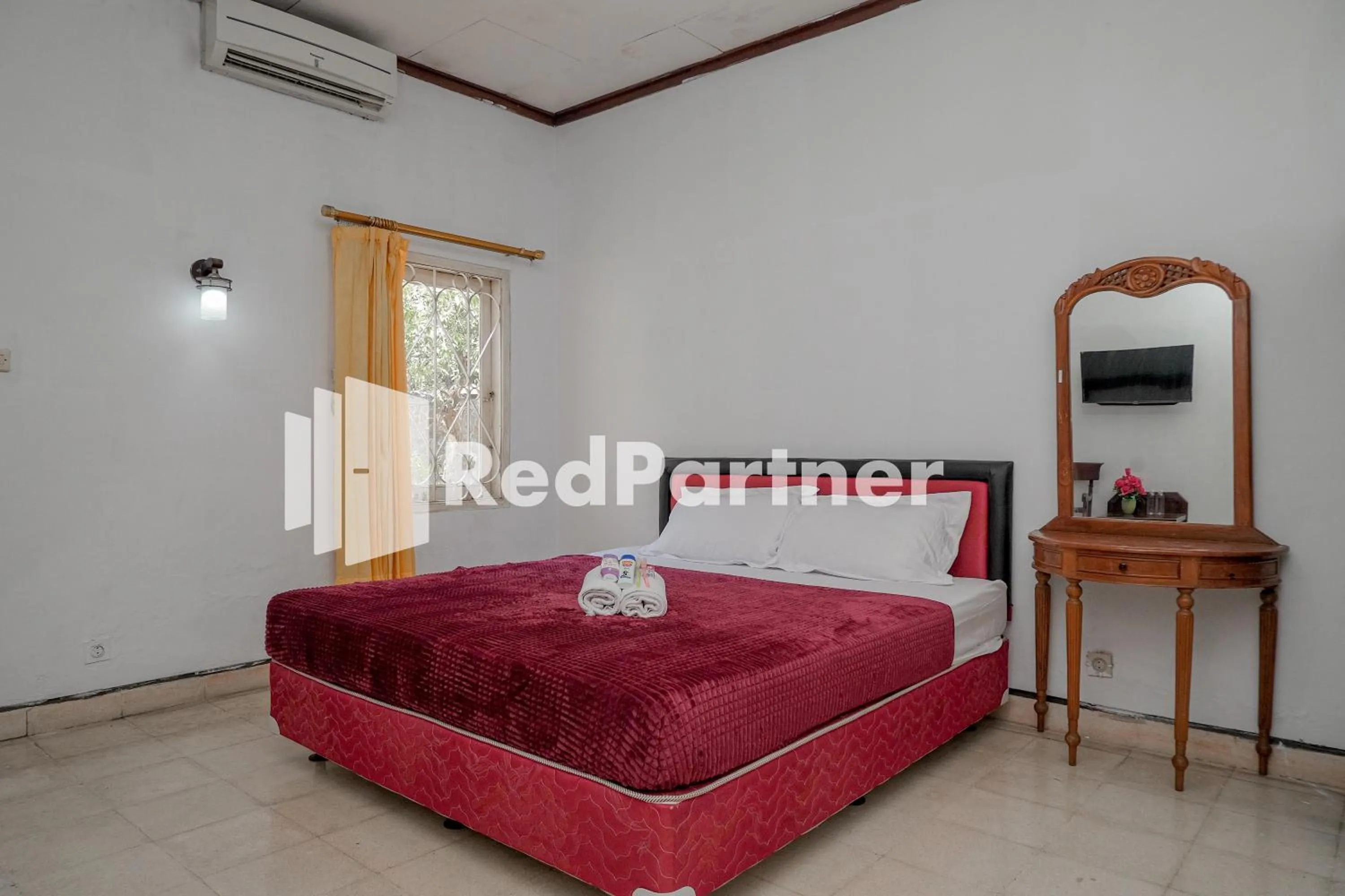 Bedroom in Rajawali Guest House Mitra RedDoorz