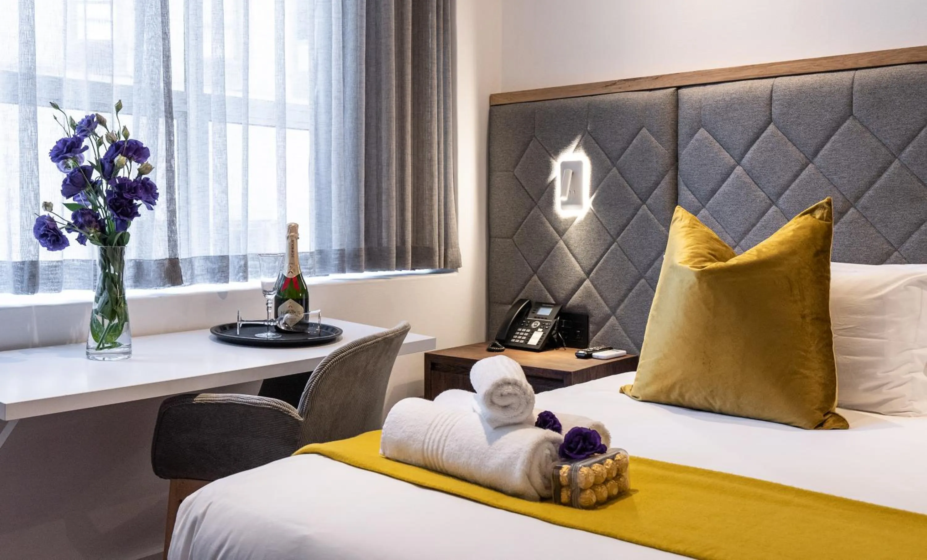 Bed in Cape Diamond Boutique Hotel