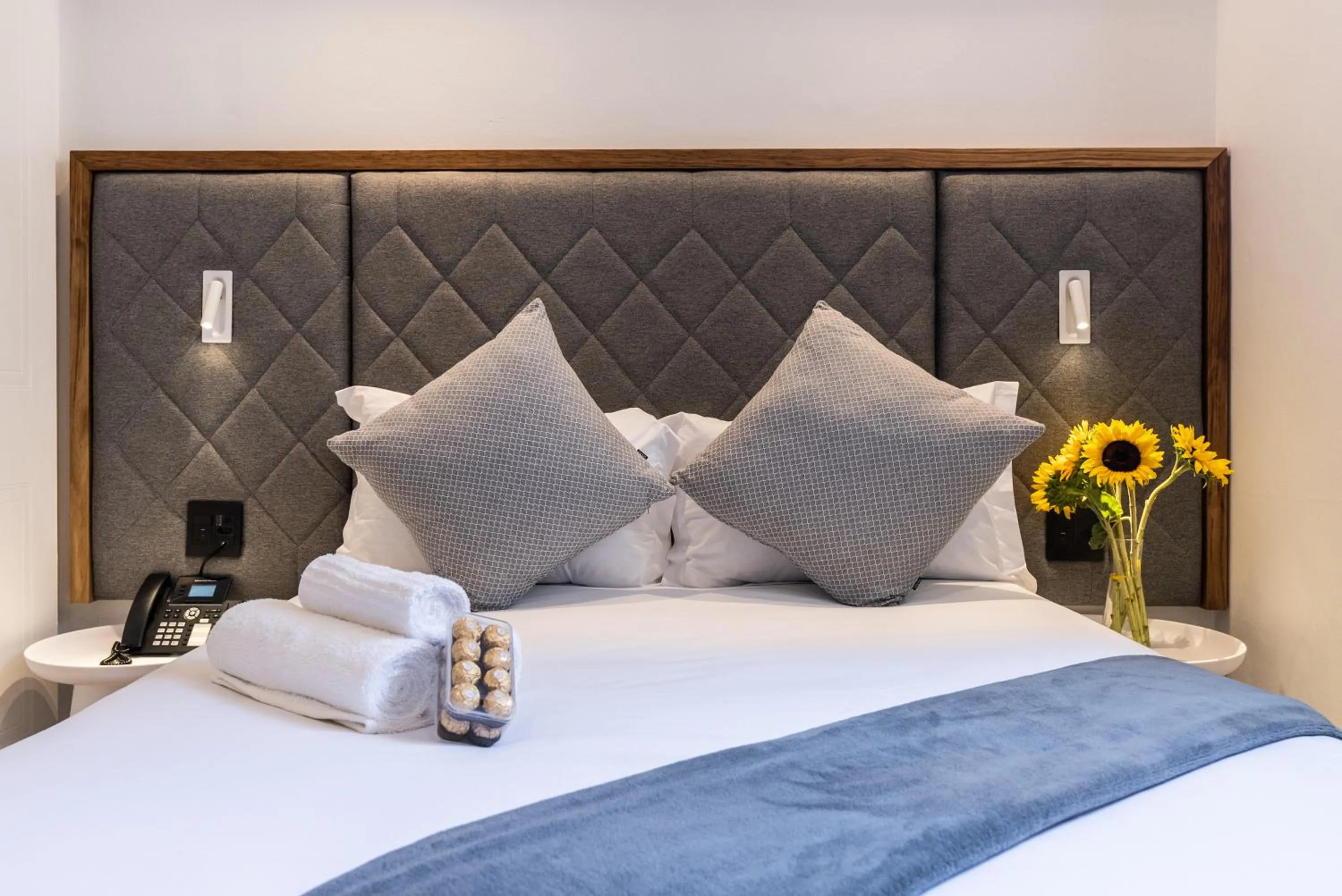 Bed in Cape Diamond Boutique Hotel