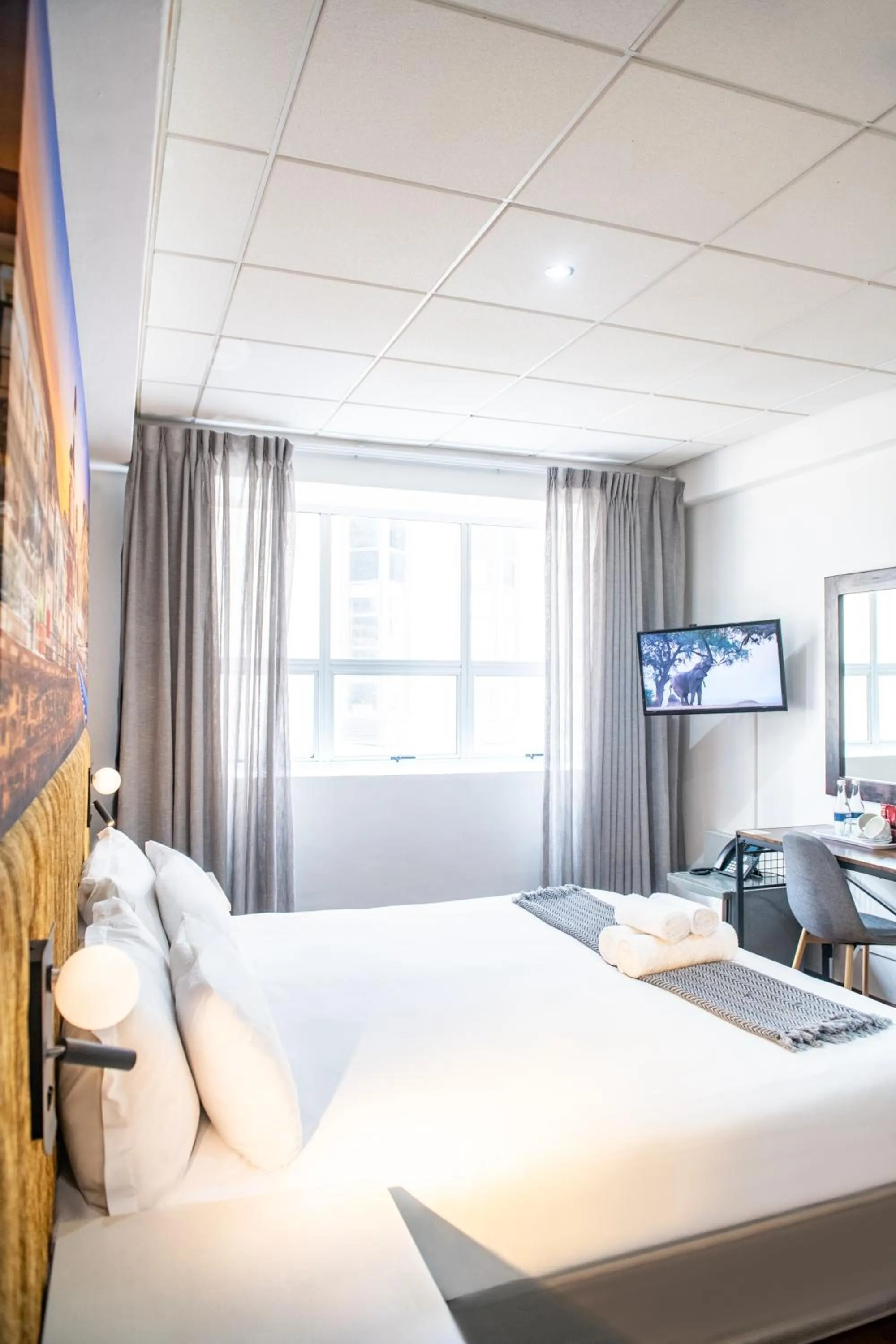 Photo of the whole room, Bed in Cape Diamond Boutique Hotel