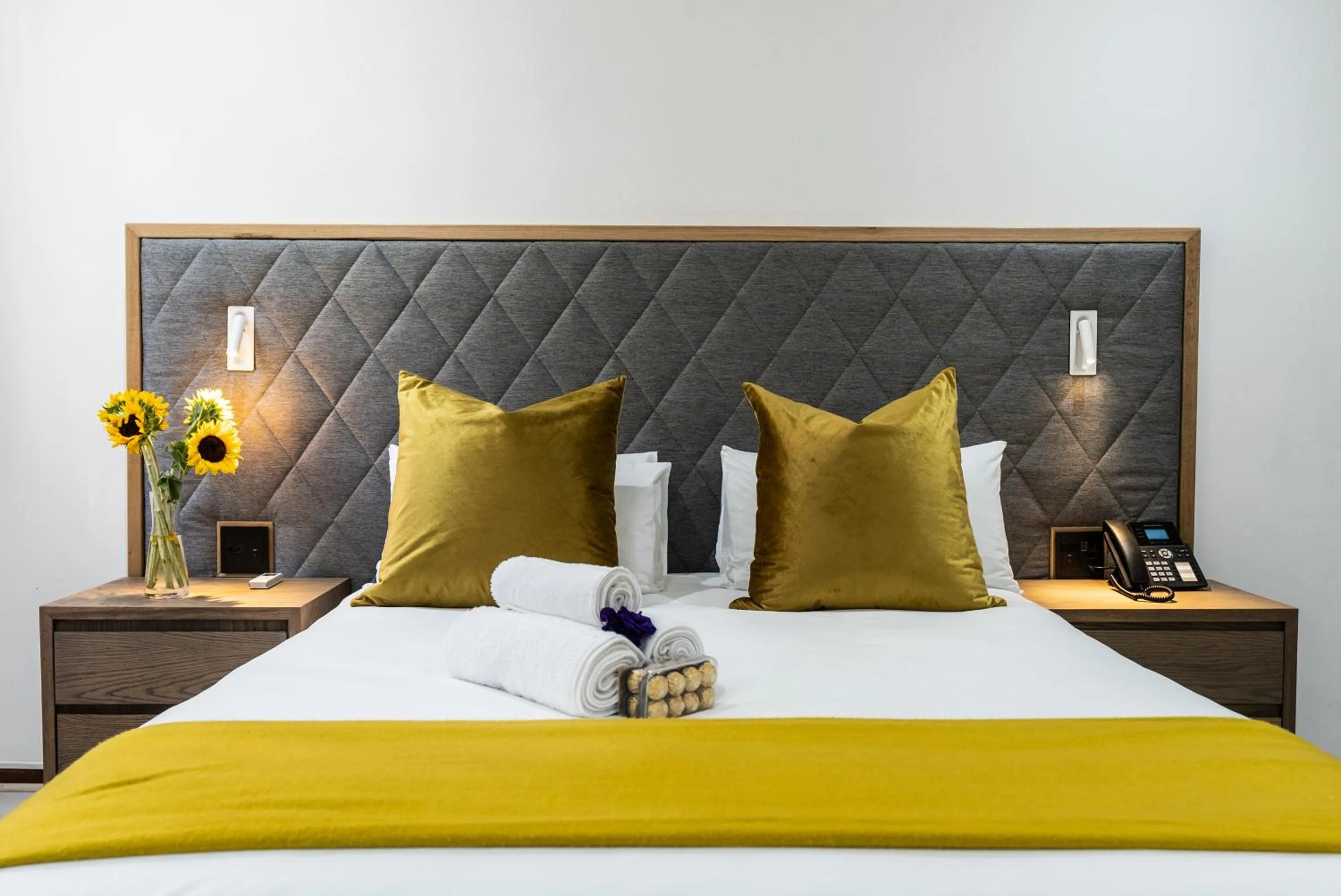 Bed in Cape Diamond Boutique Hotel