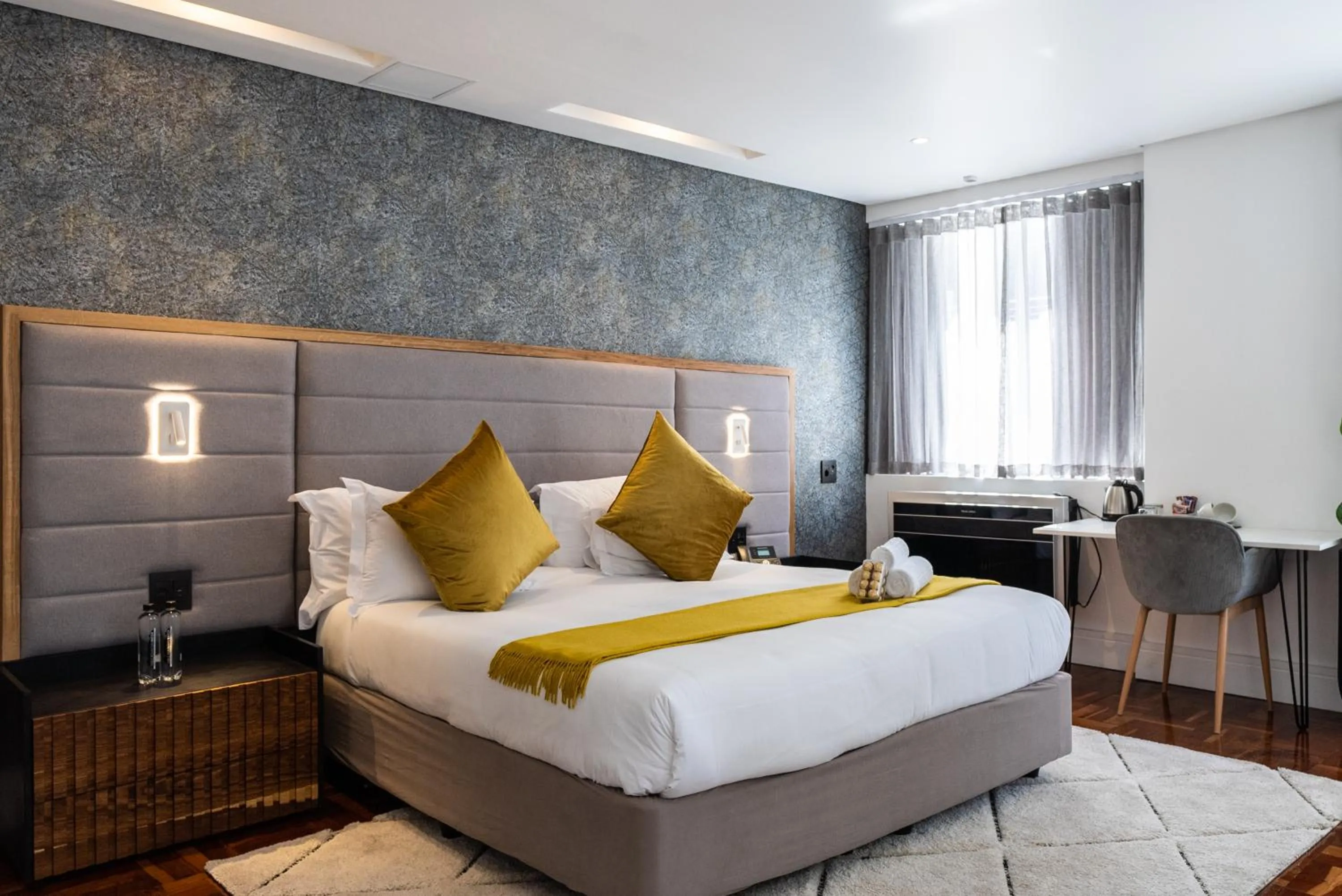 Bed in Cape Diamond Boutique Hotel