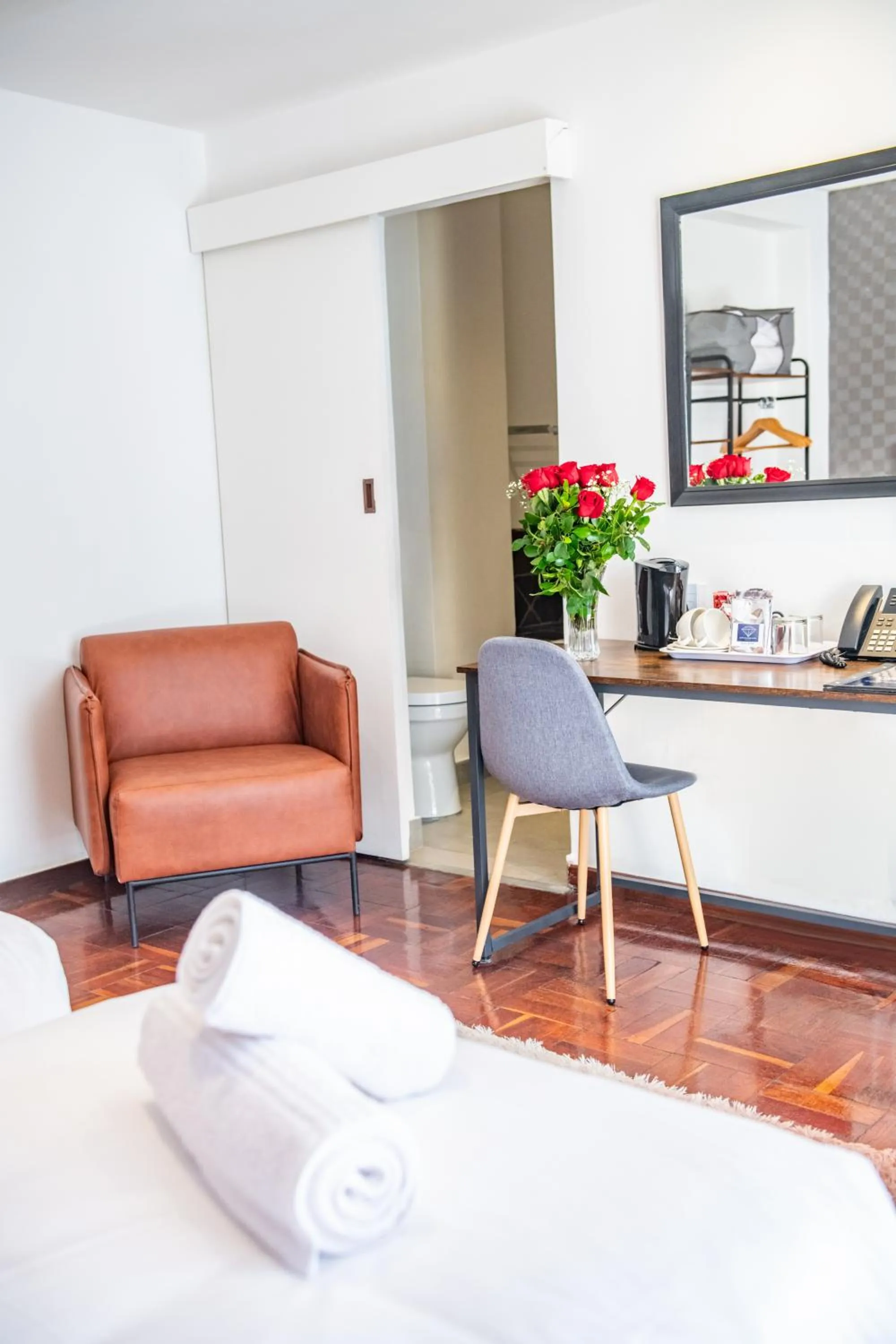 Seating area, Bed in Cape Diamond Boutique Hotel