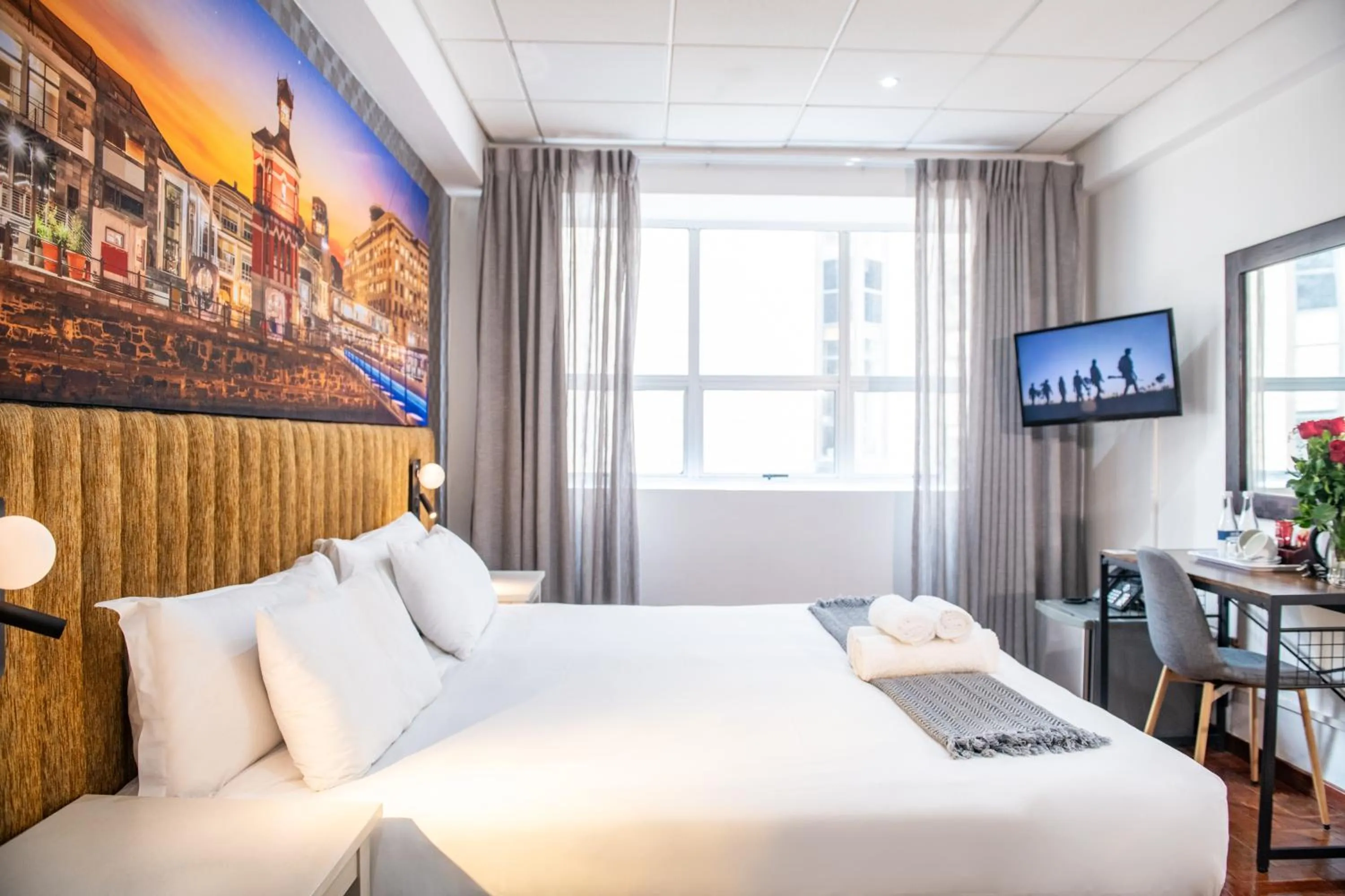 Bed in Cape Diamond Boutique Hotel