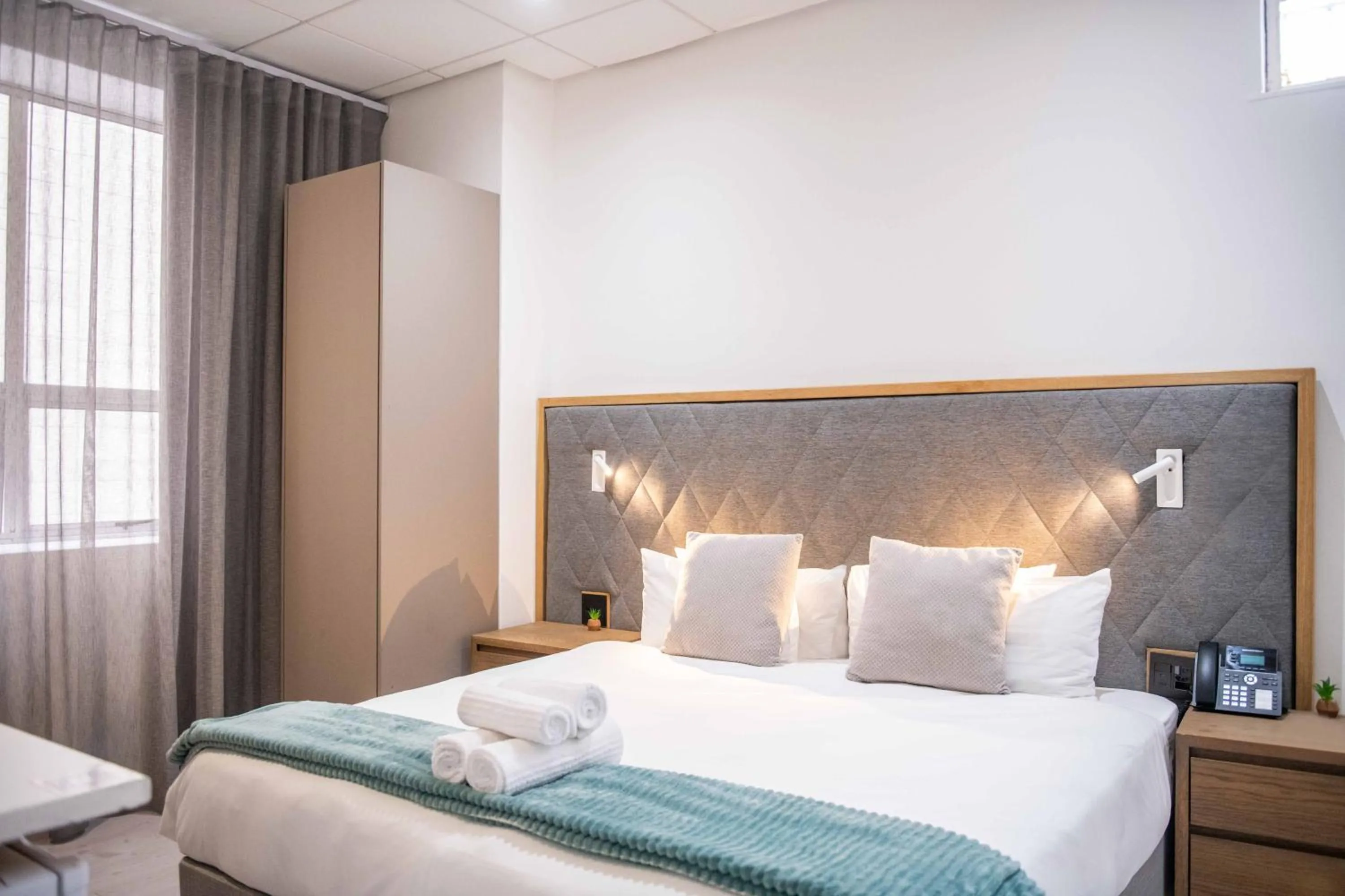 Bed in Cape Diamond Boutique Hotel