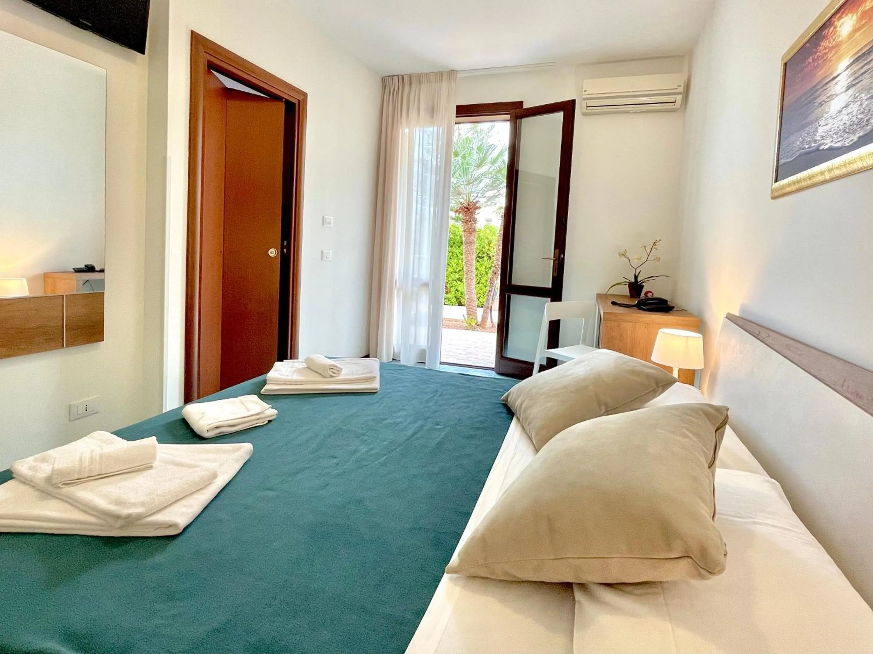 View (from property/room), Bed in Hotel Sikania