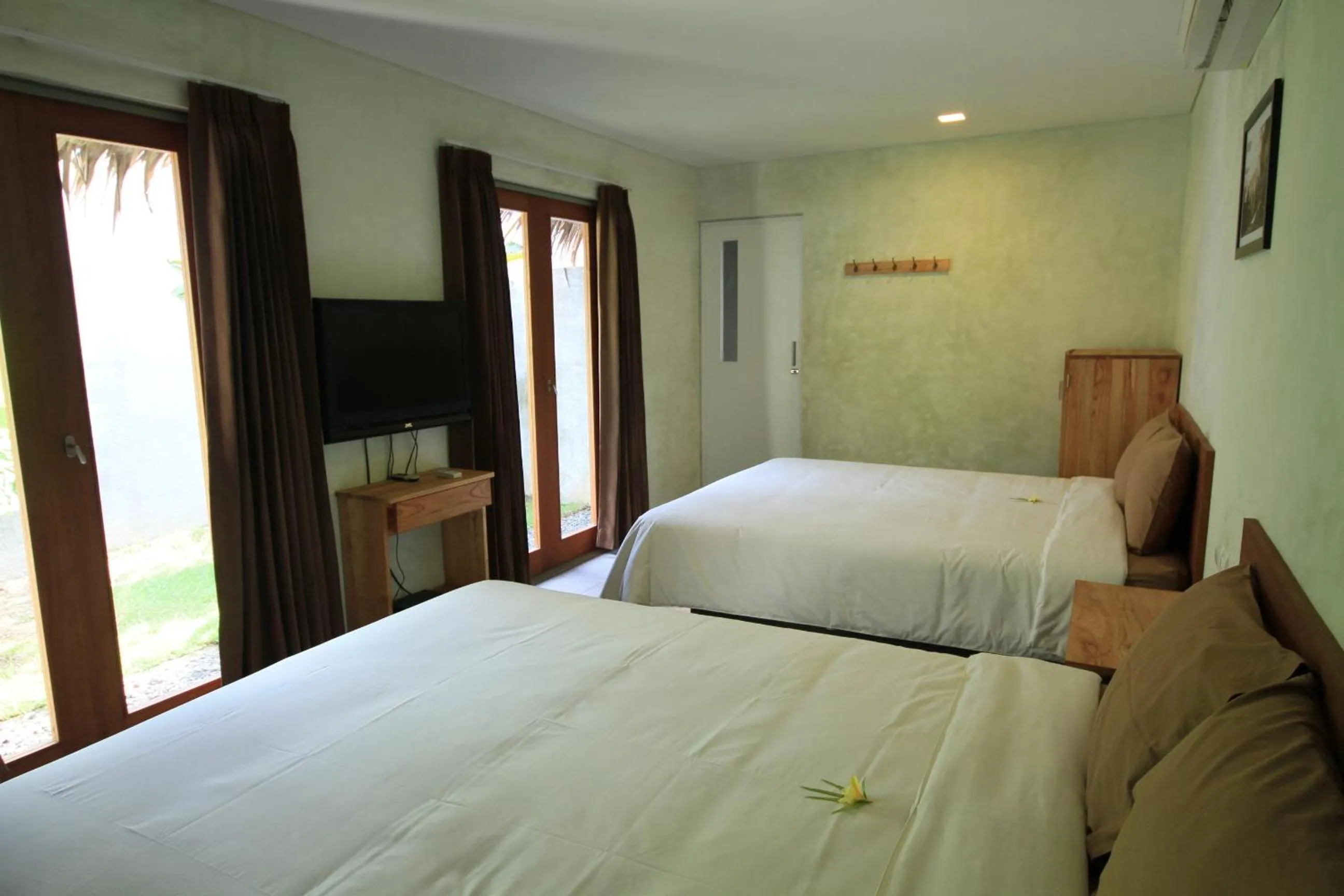 Bed in Bale Karang Cottages