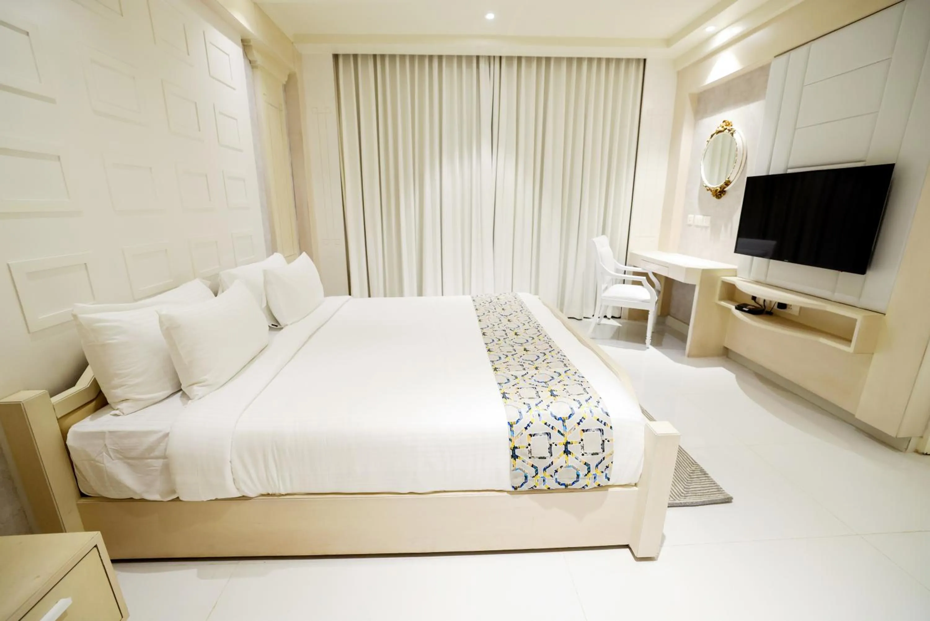 Bed in AJ Grand Hotel