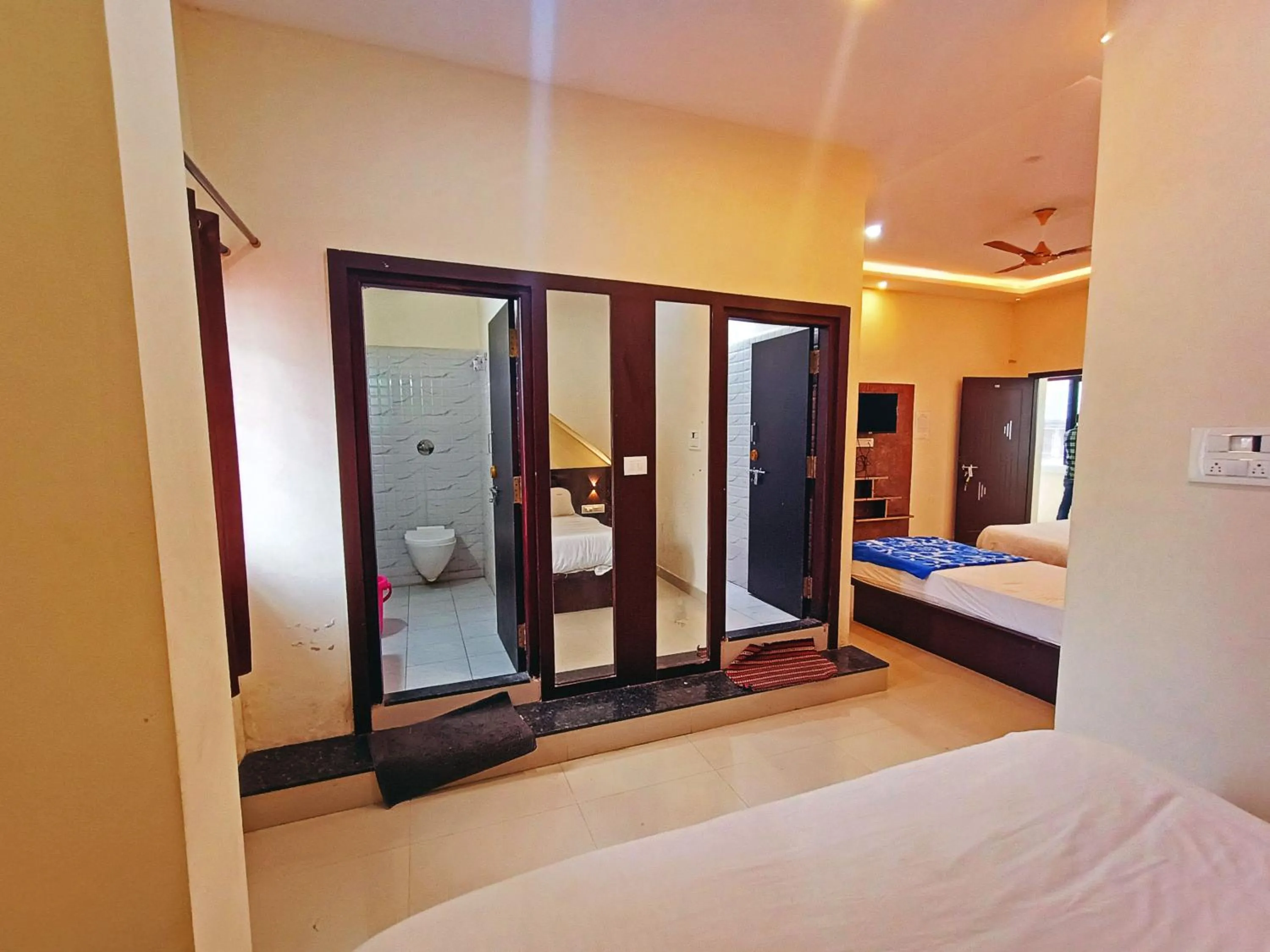 Bathroom, Bed in MG Residency