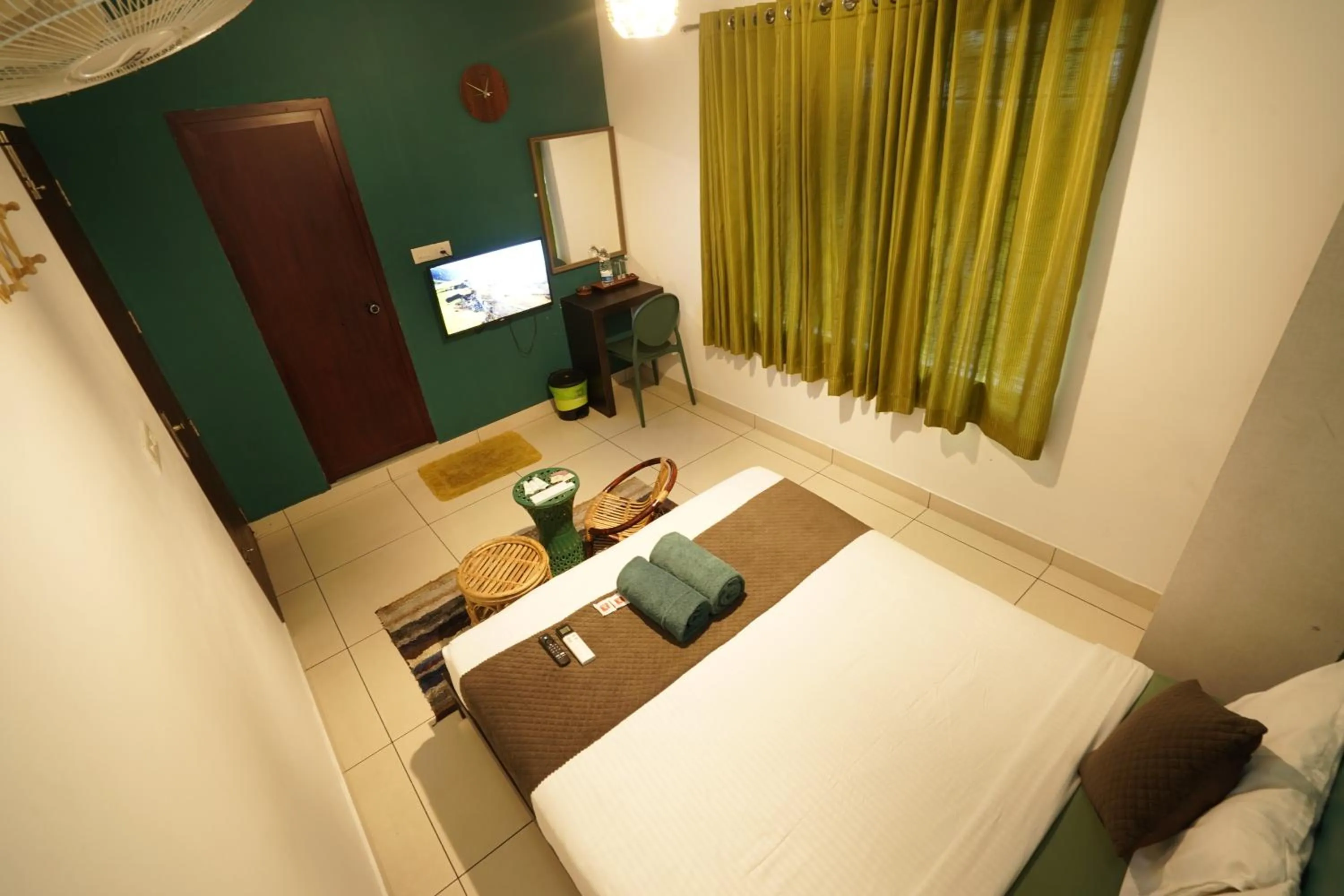 Bed in Atmos Inn Calicut Near Aster Mims Hospital