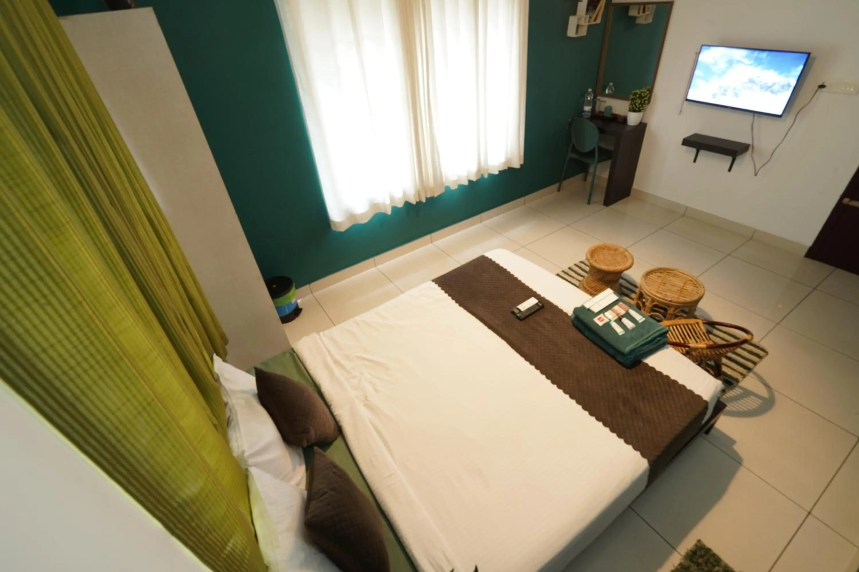 Bed in Atmos Inn Calicut Near Aster Mims Hospital