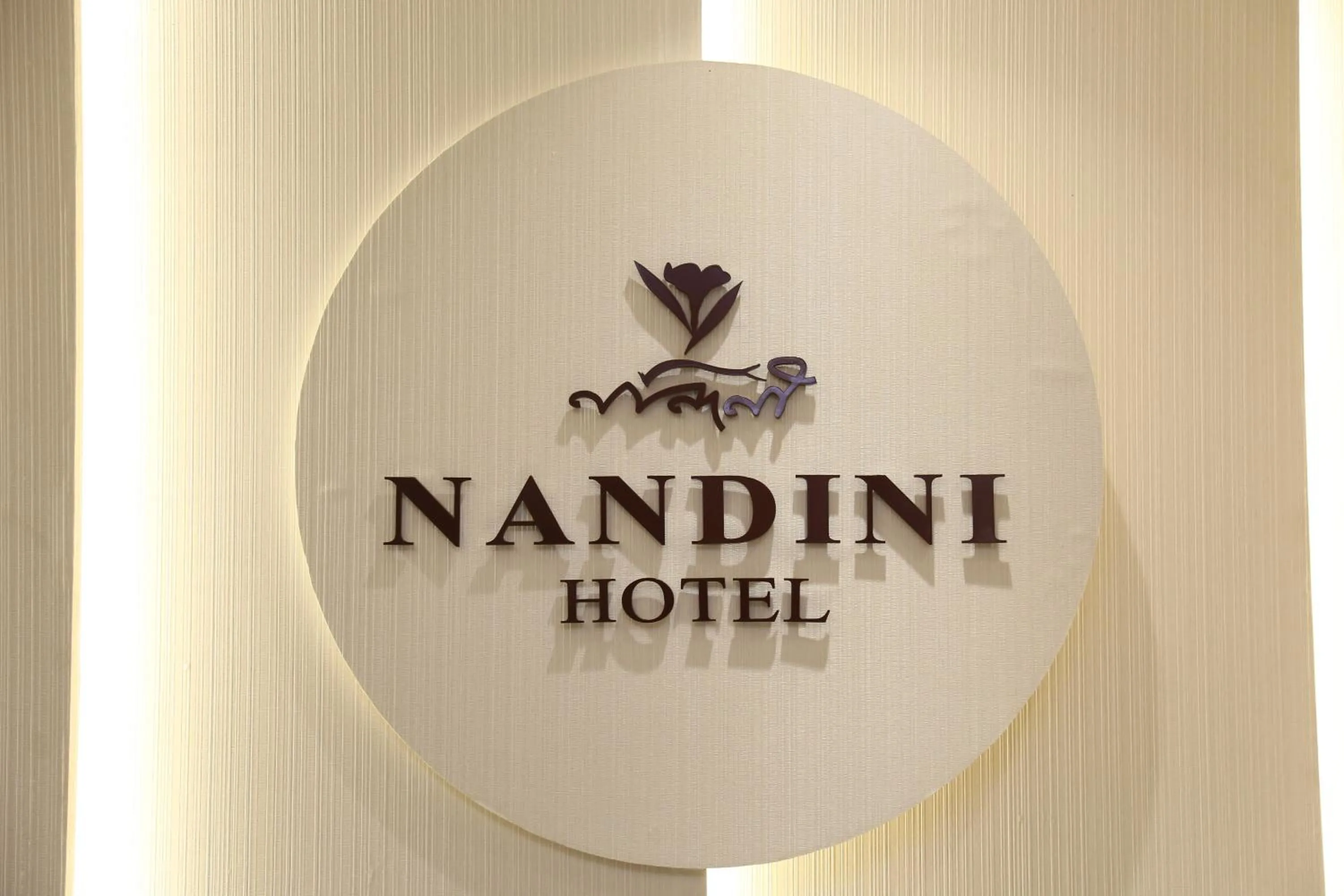 Property logo or sign in Hotel Nandini