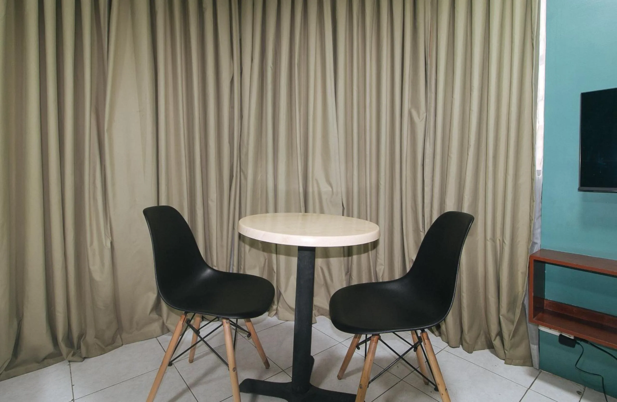 Dining area in Rcee Place by RedDoorz