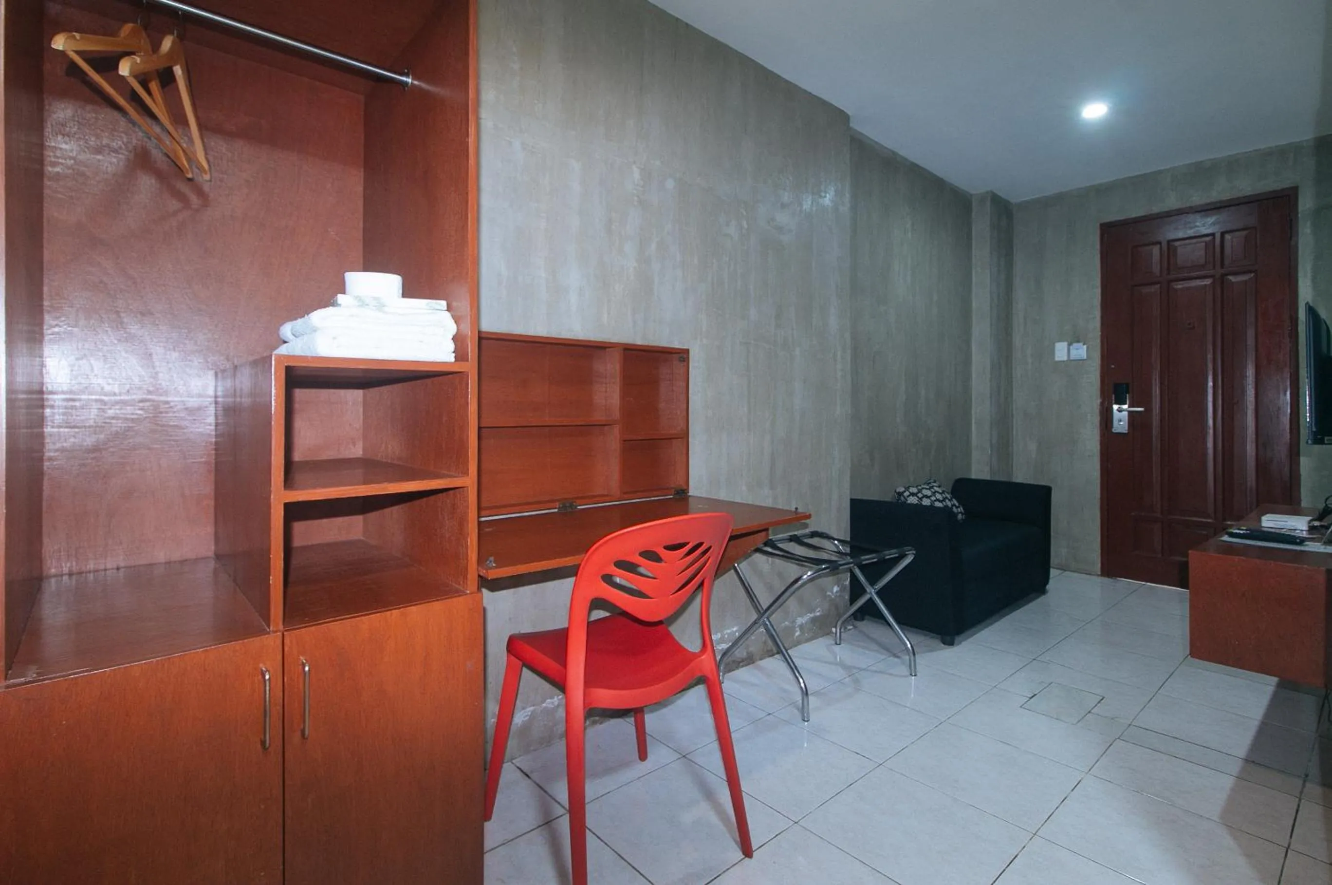 Living room in Rcee Place by RedDoorz