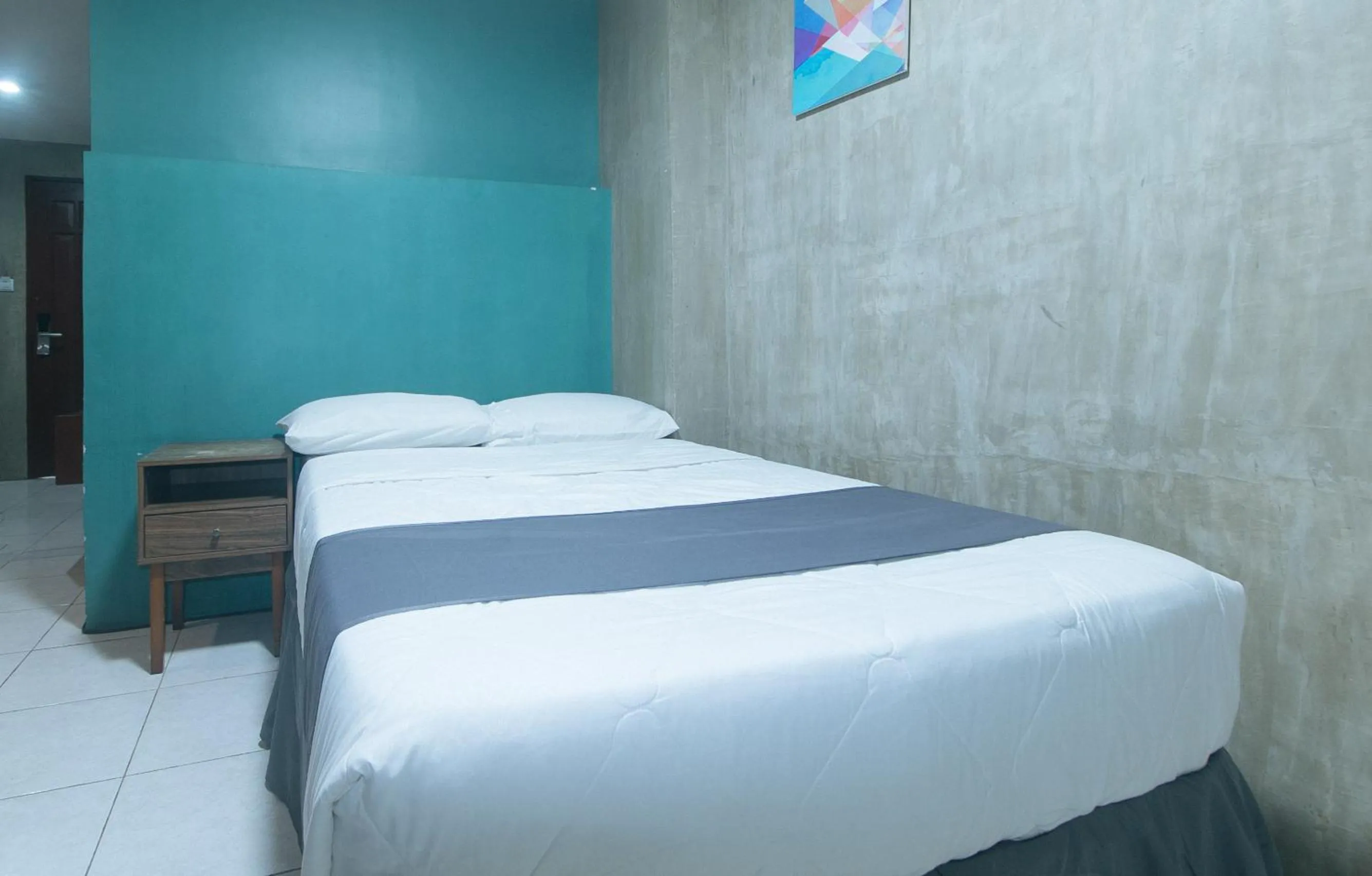 Bed in Rcee Place by RedDoorz