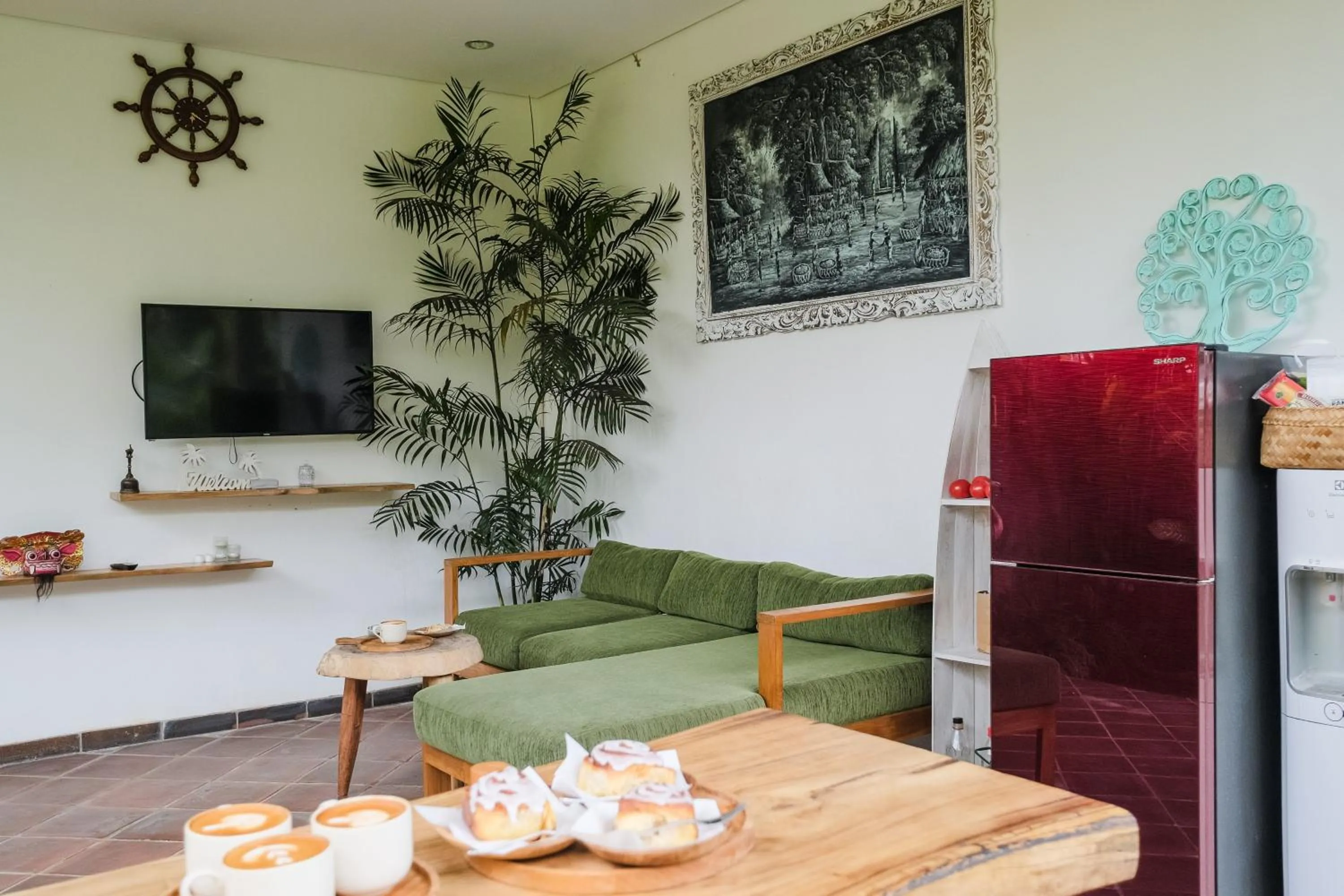 Communal lounge/ TV room in The Kumpi Bali by The Lavana