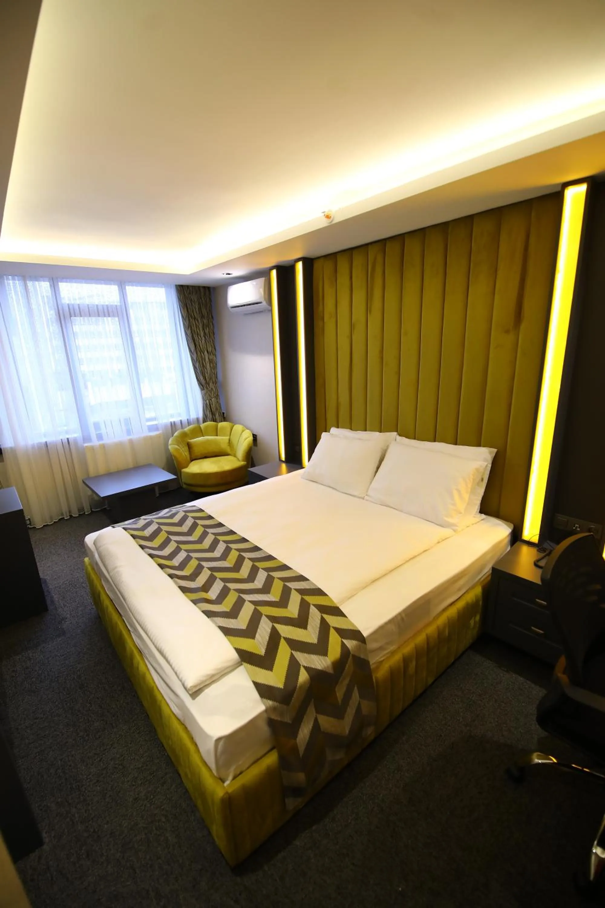 Bed in GRAND DORA HOTEL