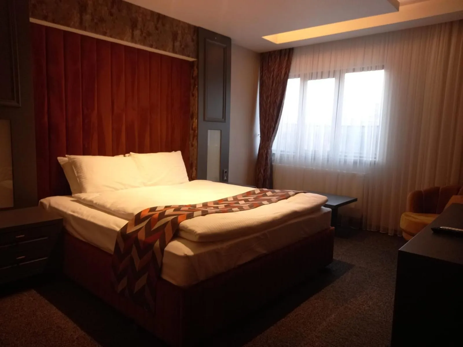 Bed in GRAND DORA HOTEL