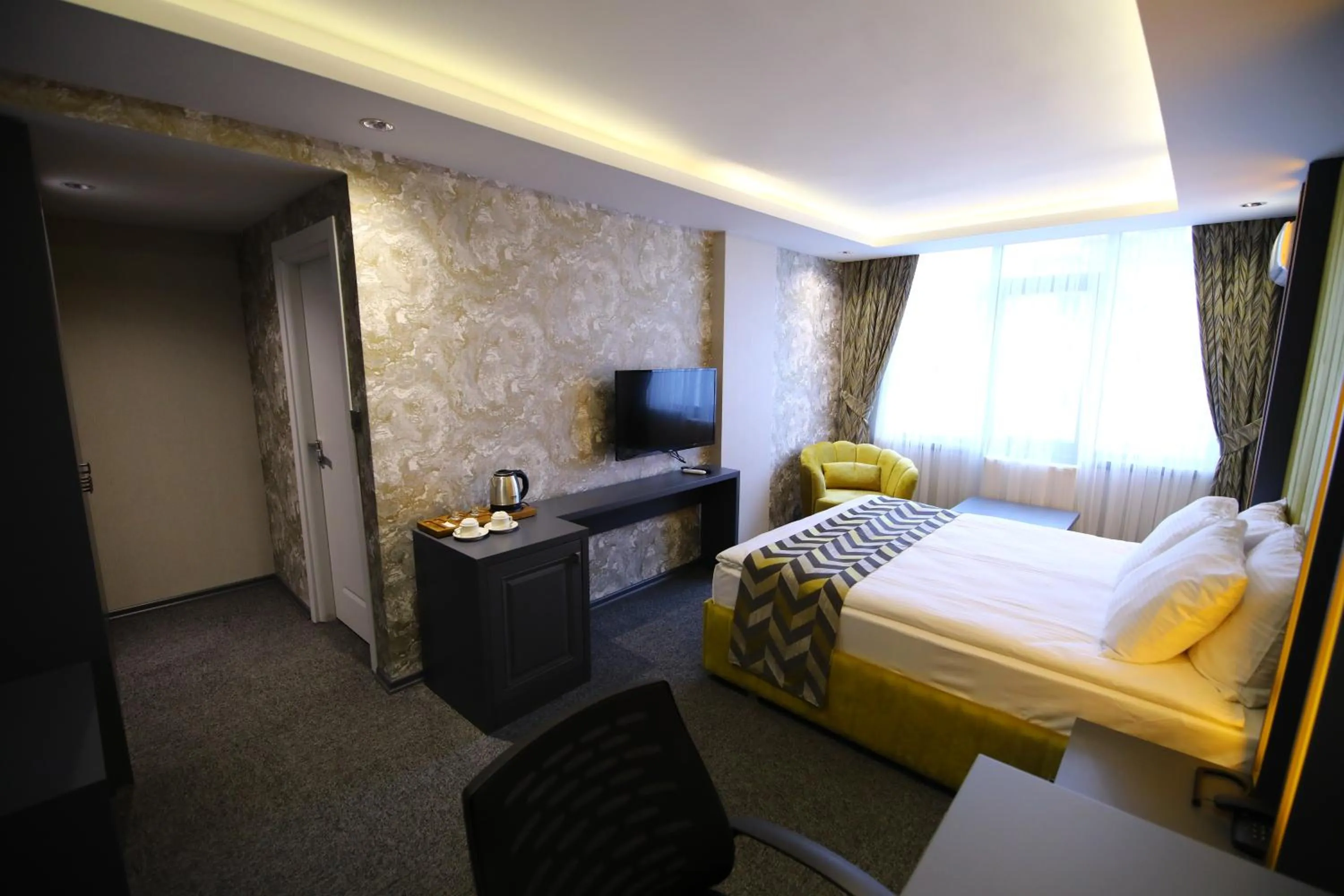 Bed in GRAND DORA HOTEL