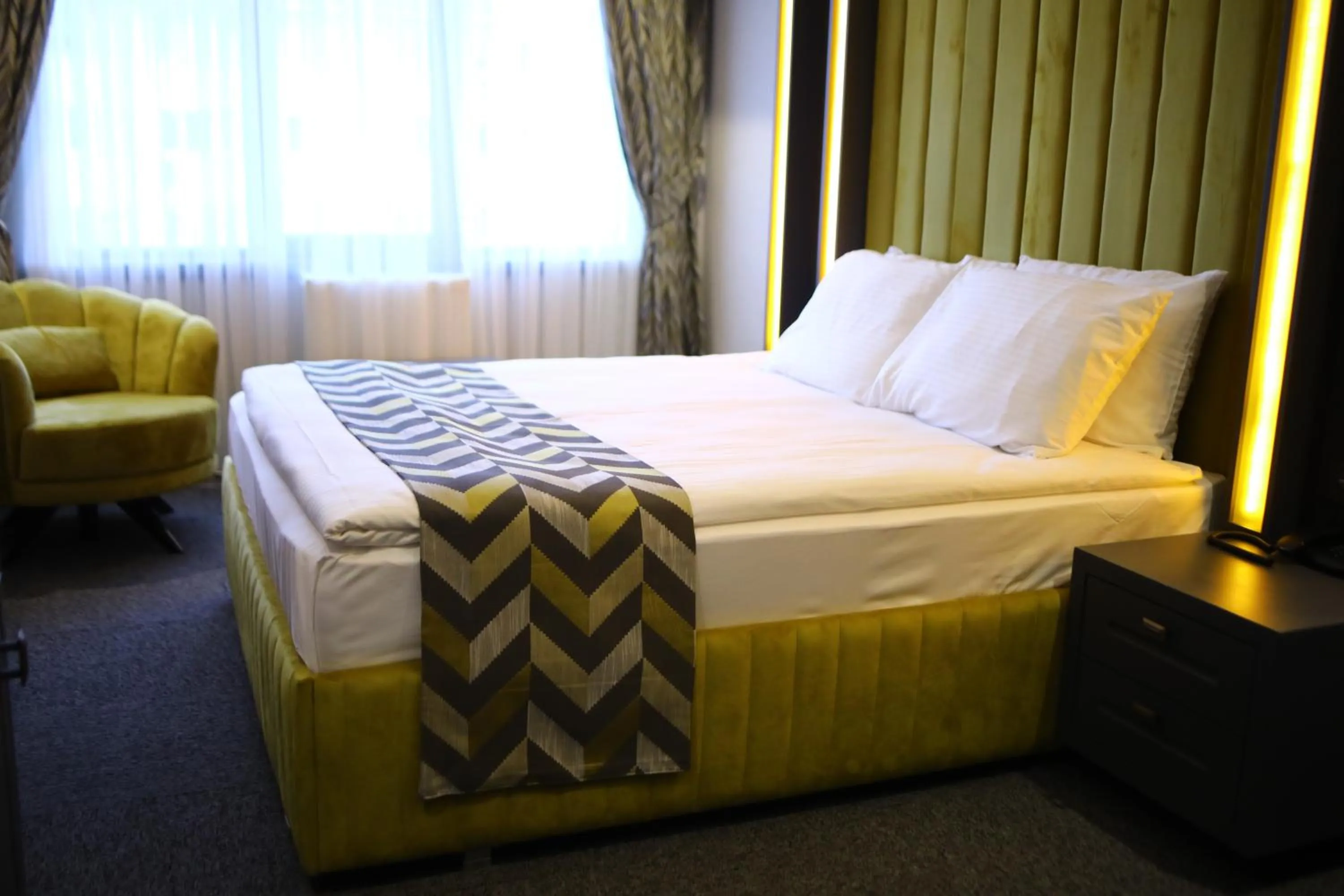 Bed in GRAND DORA HOTEL