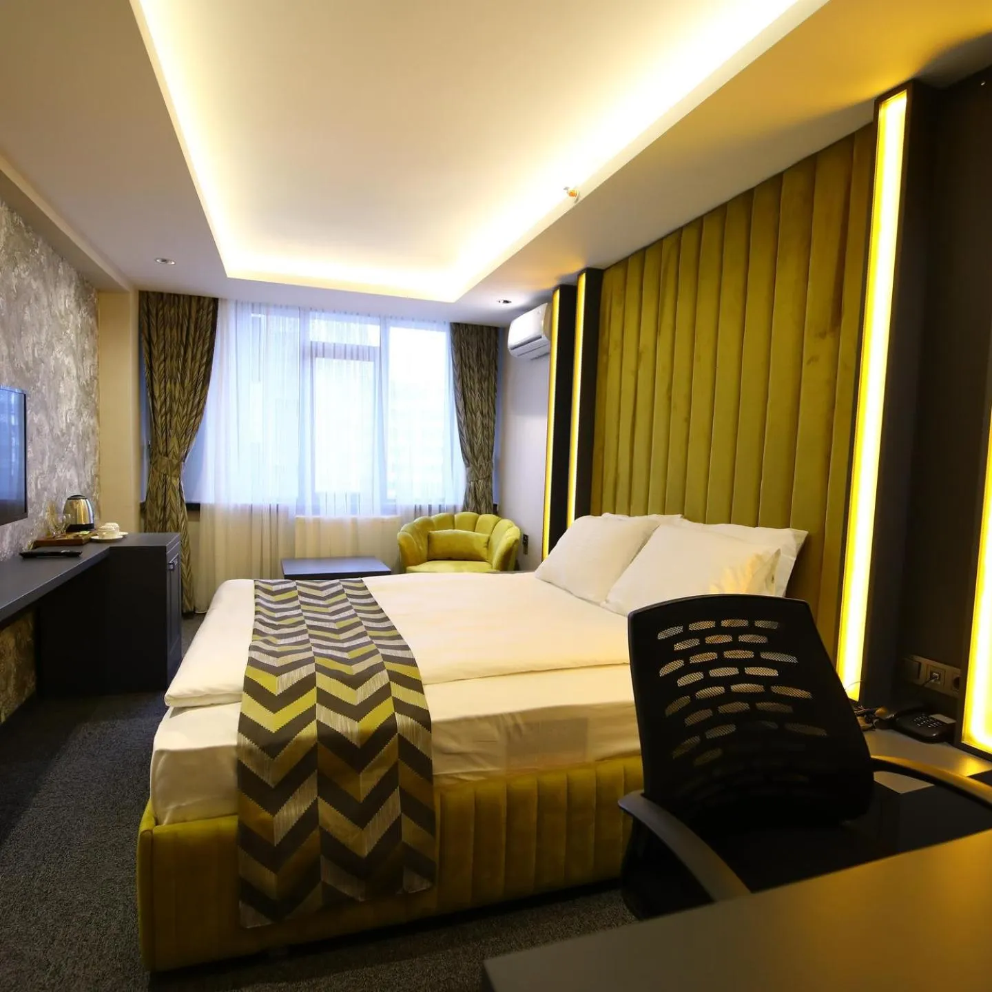 Bed in GRAND DORA HOTEL